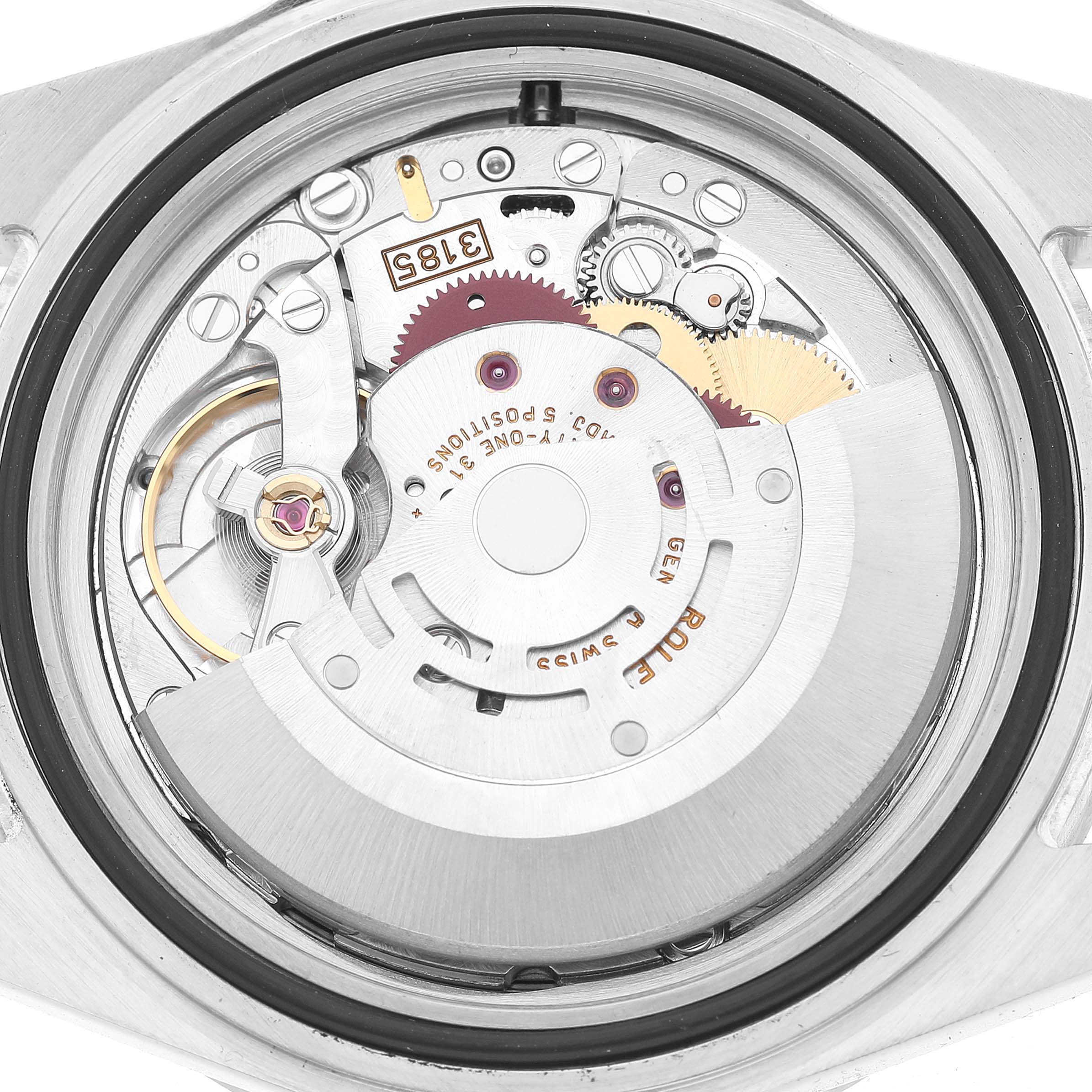 The image shows the internal mechanism of a Rolex Explorer 16570 Men's Stainless Steel Black Dial watch from a back view, highlighting gears and moving parts.