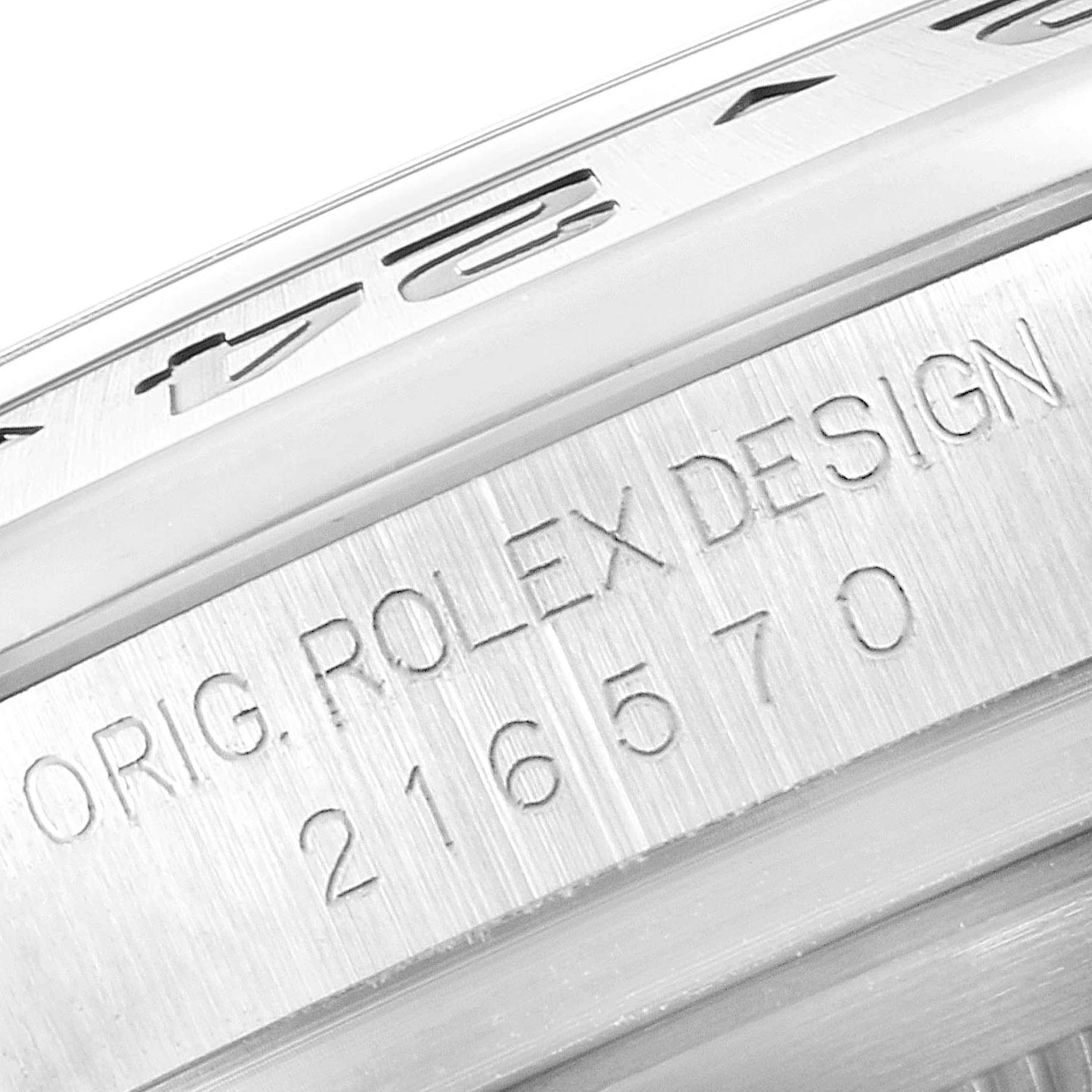 The image shows a close-up of the engraved bezel and case side of a Rolex Explorer 216570 Men's Stainless Steel White Dial 216570 Men's Stainless Steel White Dial, displaying the model number 216570.