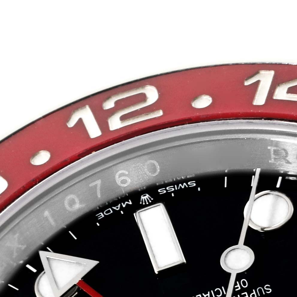 This close-up image shows the red and silver bezel, black dial, and clock hands of the Rolex GMT-Master 126710BLRO Men
s Stainless Steel Black Dial 126710BLRO Men
s Stainless Steel Black Dial watch.