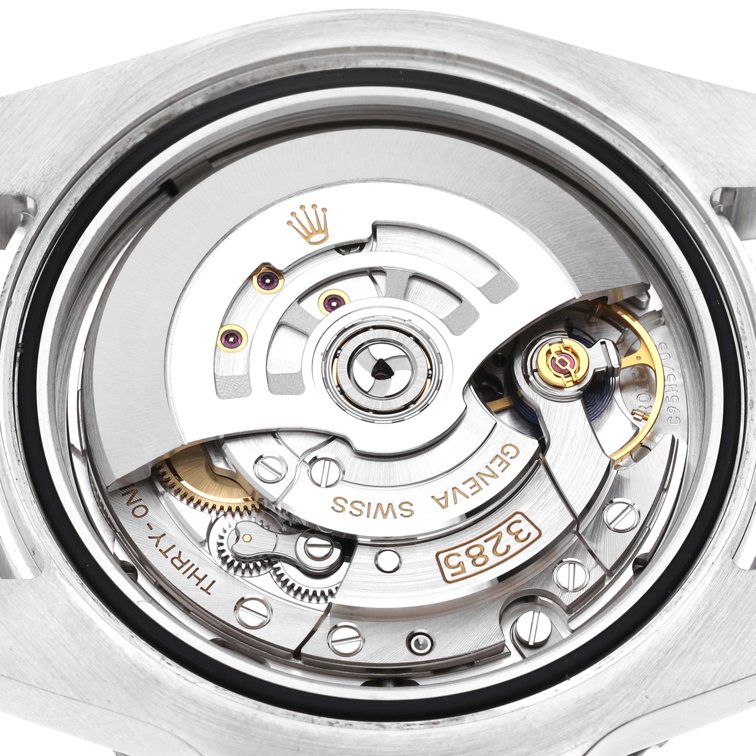 This image shows the inner movement mechanism of a Rolex GMT-Master 126710BLRO Men
s Stainless Steel Black Dial 126710BLRO Men
s Stainless Steel Black Dial watch, featuring gears, the rotor, and inscriptions.