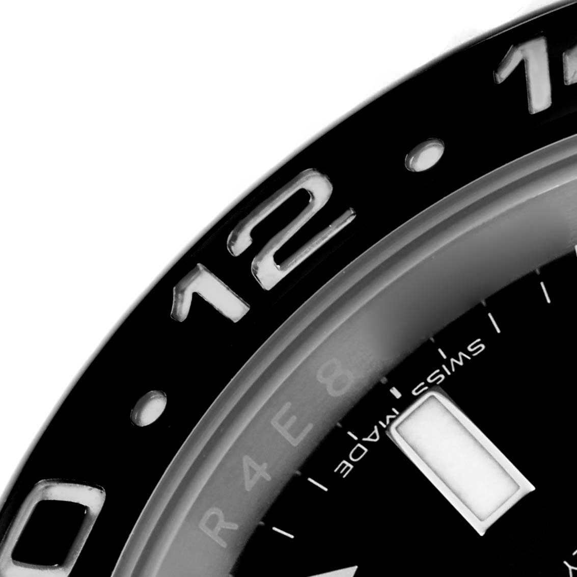 The image shows a close-up of the bezel and part of the dial of a Rolex GMT-Master 116710LN Men
s Stainless Steel Black Dial 116710LN Men
s Stainless Steel Black Dial.