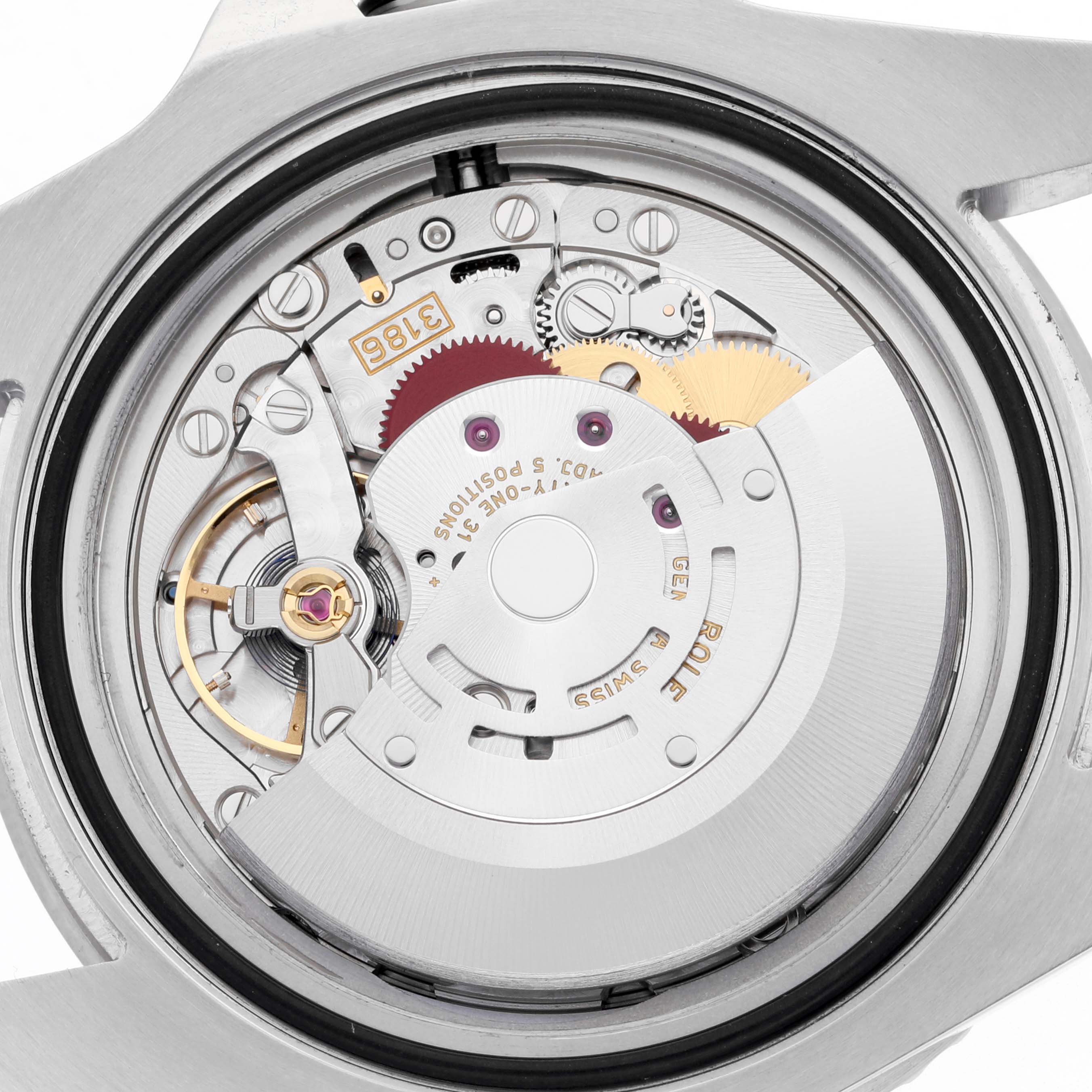 The image shows the Rolex GMT-Master 116710LN Men
s Stainless Steel Black Dial 116710LN Men
s Stainless Steel Black Dial
s movement from a back angle, highlighting the rotor and gears.