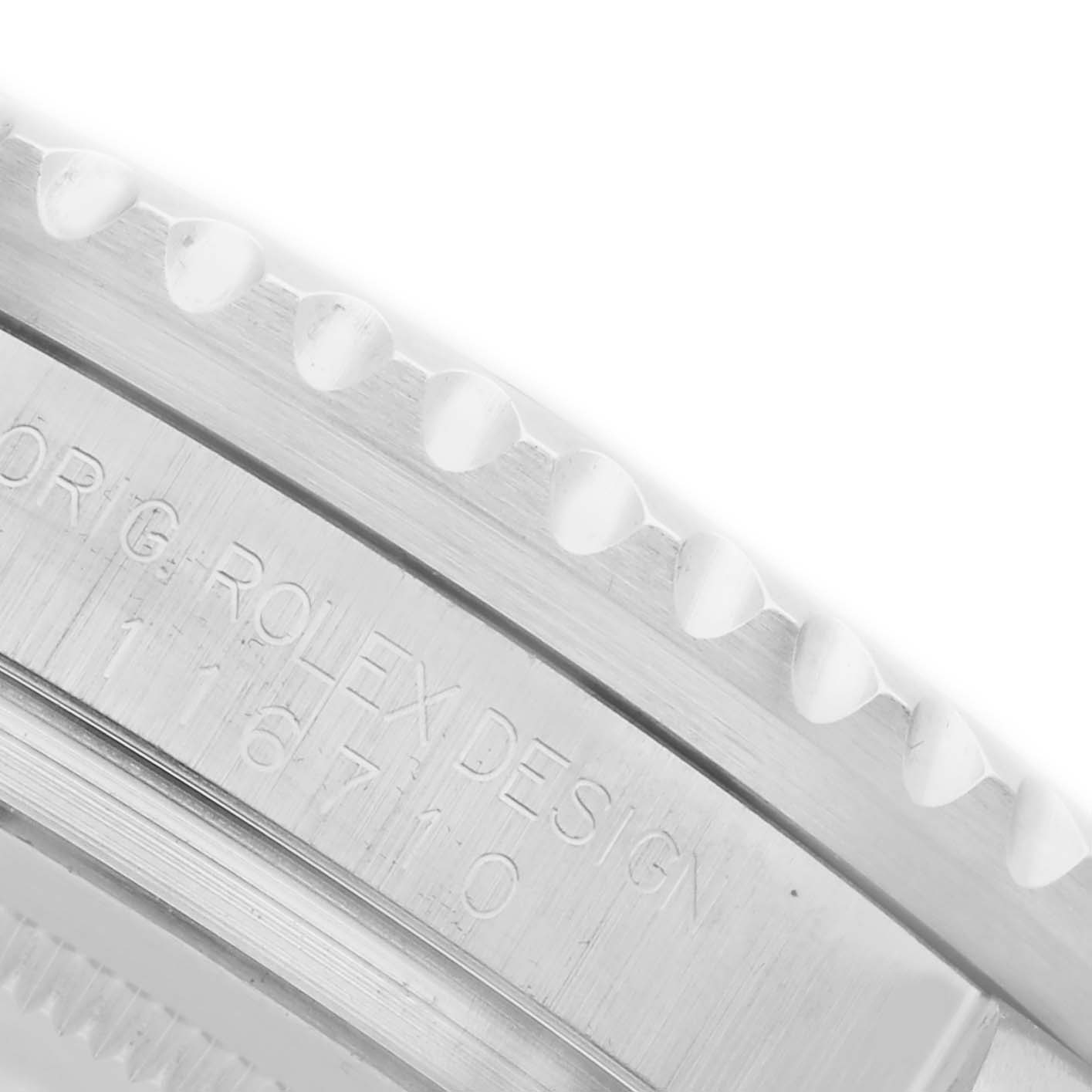 The image shows a close-up of the side and bezel edge of a Rolex GMT-Master 116710LN Men
s Stainless Steel Black Dial 116710LN Men
s Stainless Steel Black Dial watch, displaying the engraved model number.