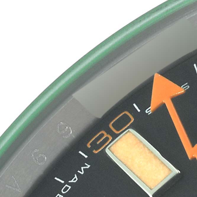 This close-up image shows the minute and second hands, and part of the dial of a Rolex Milgauss 116400GV Men's Stainless Steel Black Dial 116400GV Men's Stainless Steel Black Dial watch.