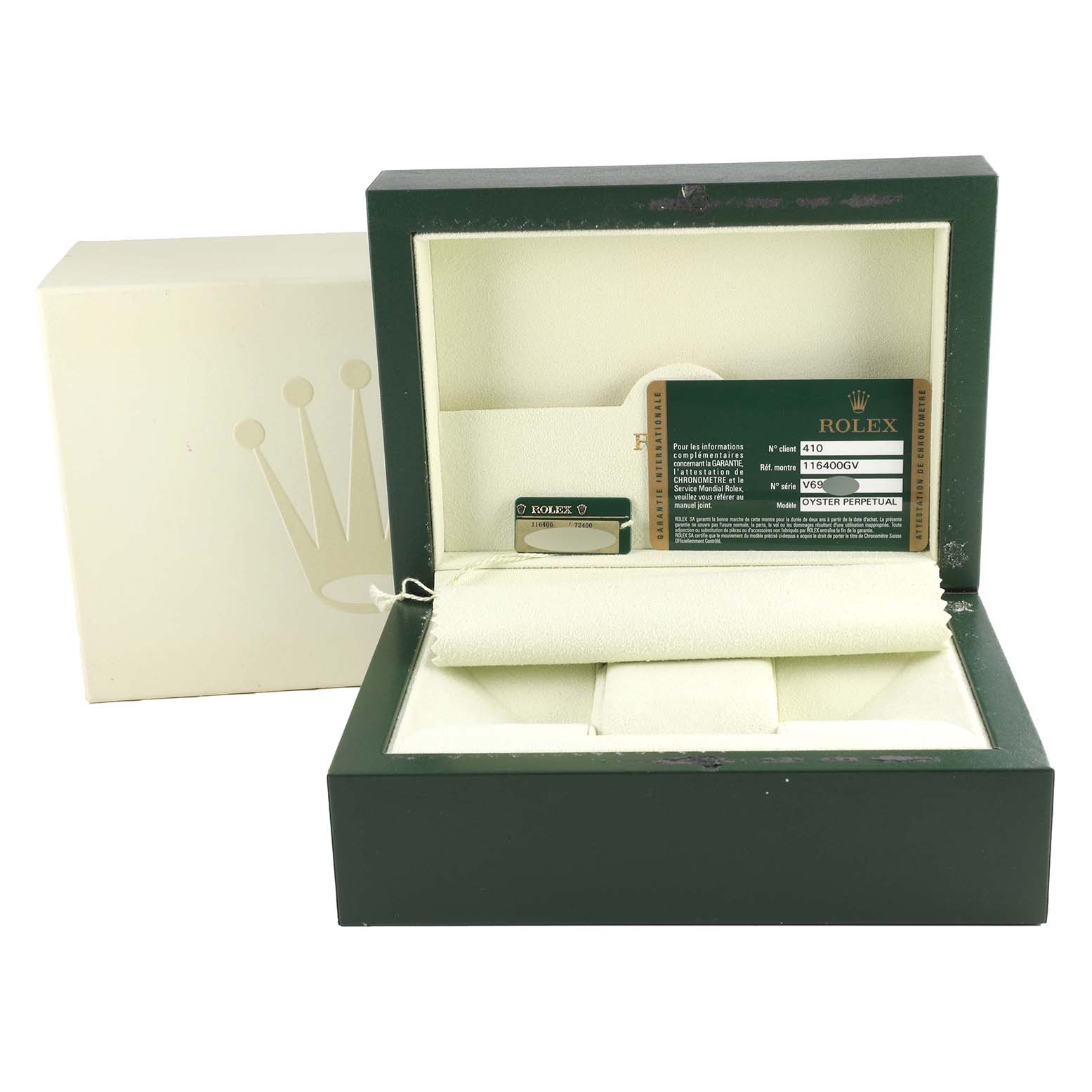 This image shows the open packaging box of a Rolex Milgauss 116400GV Men's Stainless Steel Black Dial 116400GV Men's Stainless Steel Black Dial watch, including the cushion and warranty card.