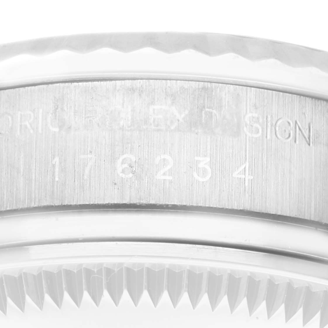 The image shows a close-up of the side of a Rolex Oyster Perpetual 176234 Women's Stainless Steel Blue Dial 176234 Women's Stainless Steel Blue Dial watch, focusing on the model engravings and the bezel.