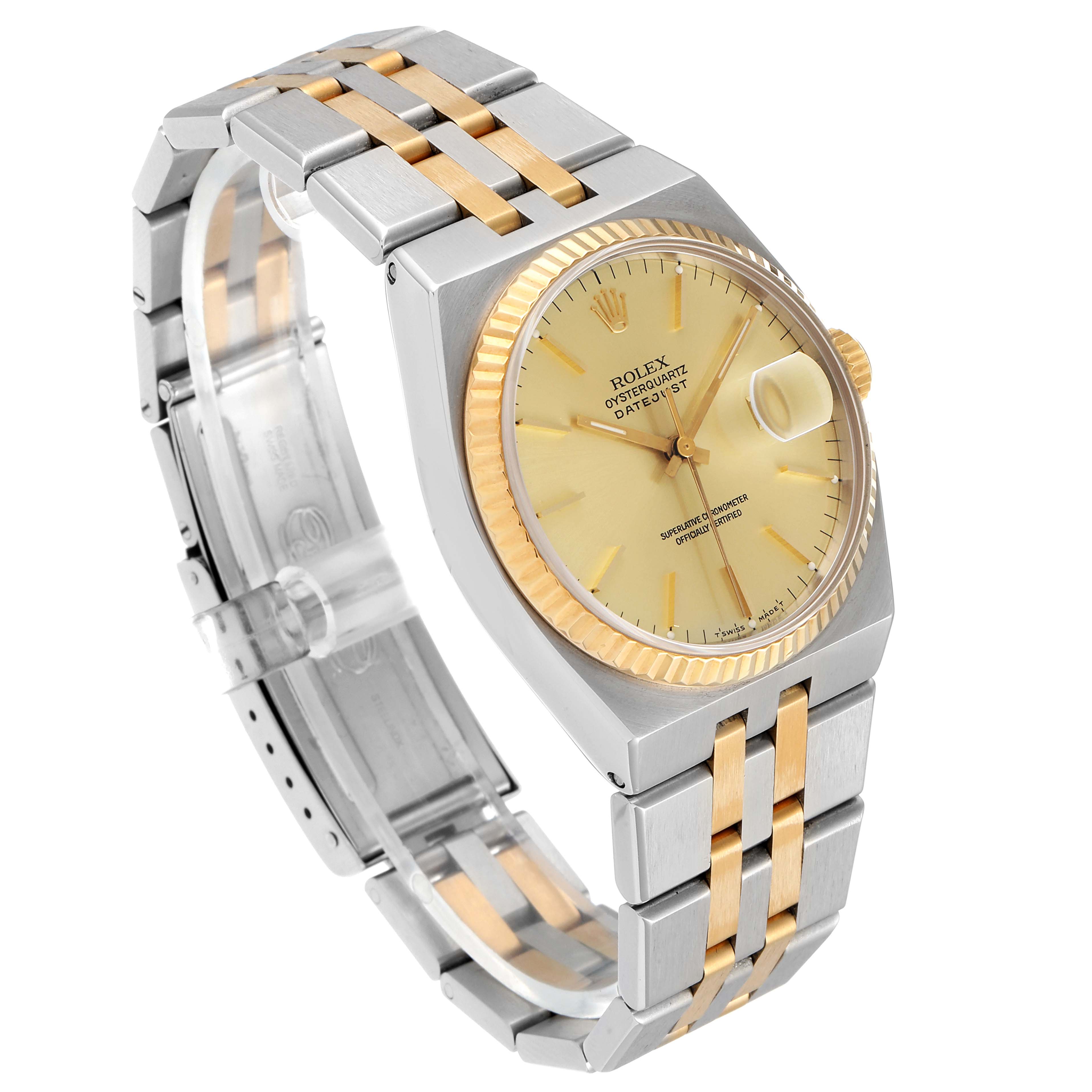 The image shows a side angle of a Rolex Oysterquartz 17013 Men's Steel and Gold (two tone) Champagne Dial 17013 Men's Steel and Gold (two tone) Champagne Dial Datejust watch, highlighting its gold and silver bracelet and fluted bezel.