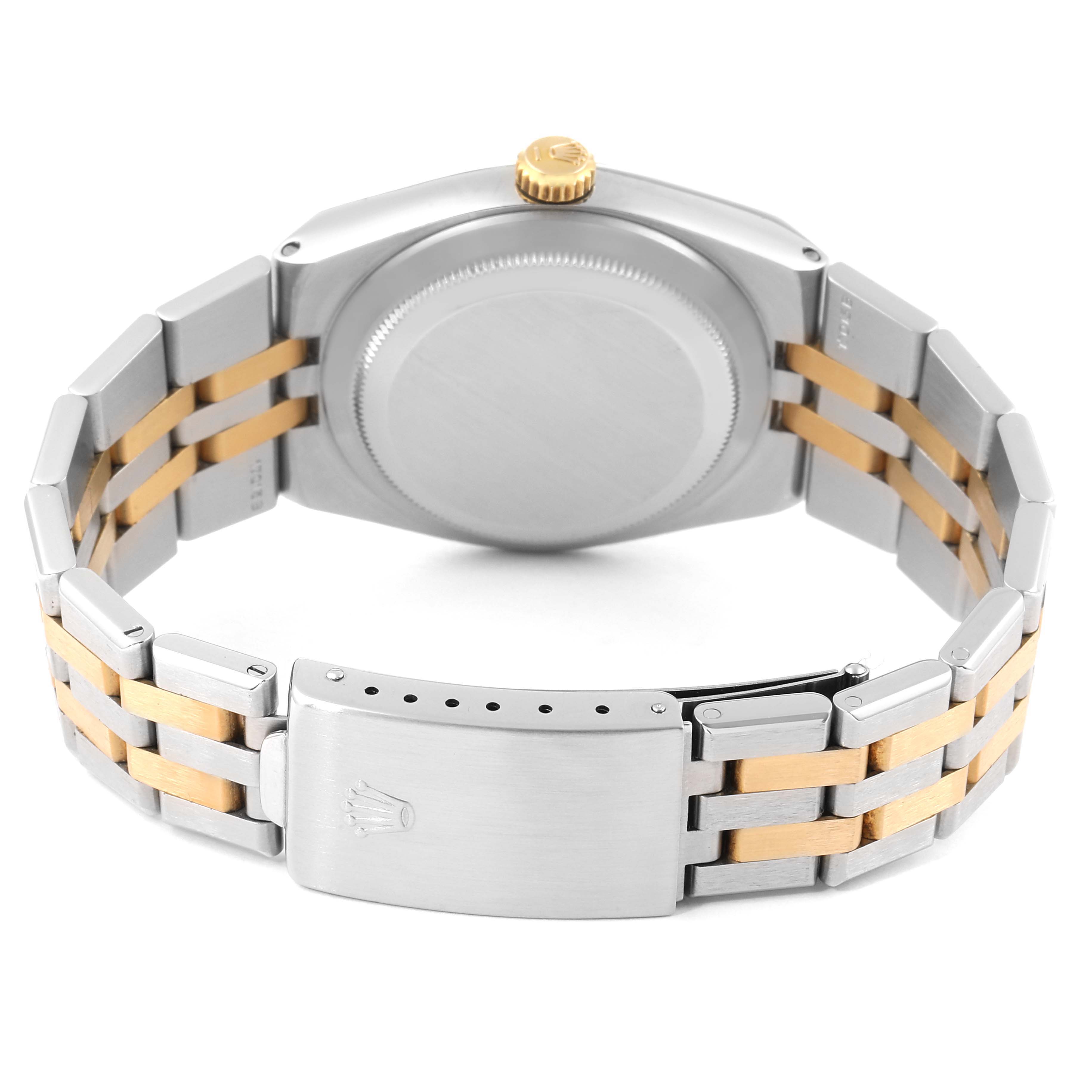 The image shows the back view of a Rolex Oysterquartz 17013 Men's Steel and Gold (two tone) Champagne Dial 17013 Men's Steel and Gold (two tone) Champagne Dial with its clasp, bracelet, and caseback visible.