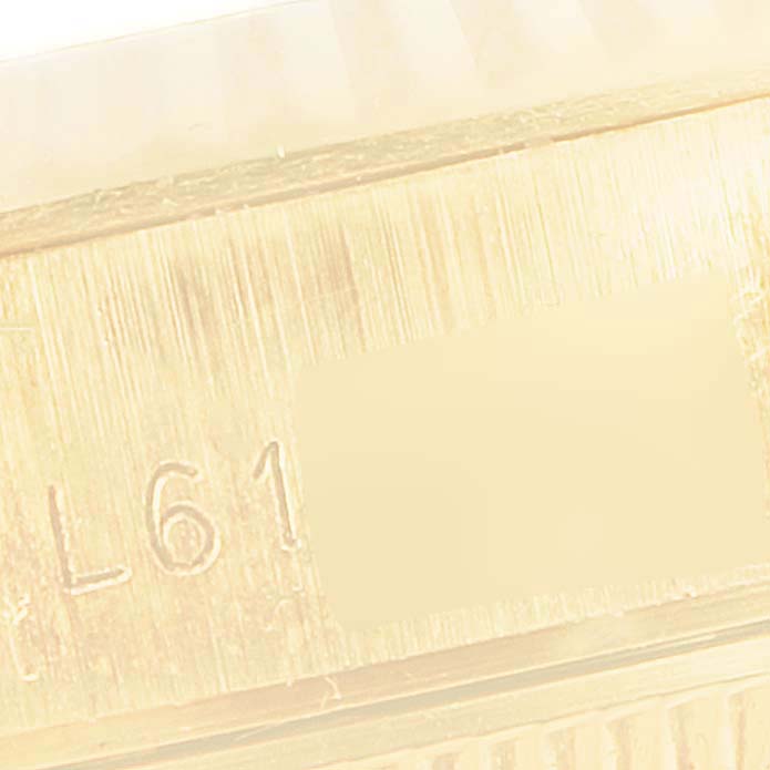 This image shows a close-up of the side of a Rolex President 69178 Women
s Yellow Gold White Dial 69178 Women
s Yellow Gold White Dial model, highlighting the engraved serial or reference number.
