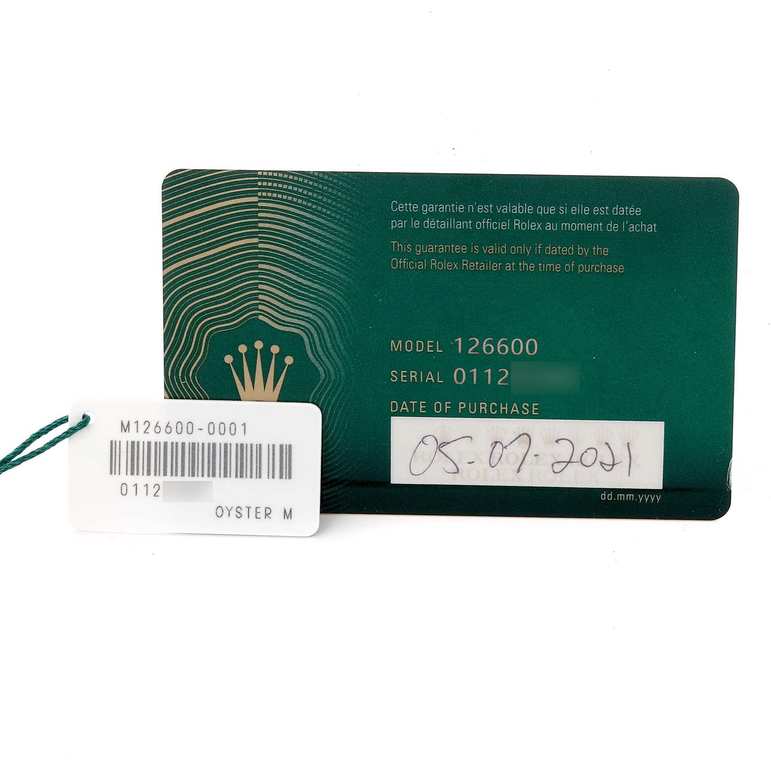 The image shows a Rolex Sea-Dweller 126600 Men's Stainless Steel Black Dial 126600 Men's Stainless Steel Black Dial warranty card and a tag with model and serial numbers.