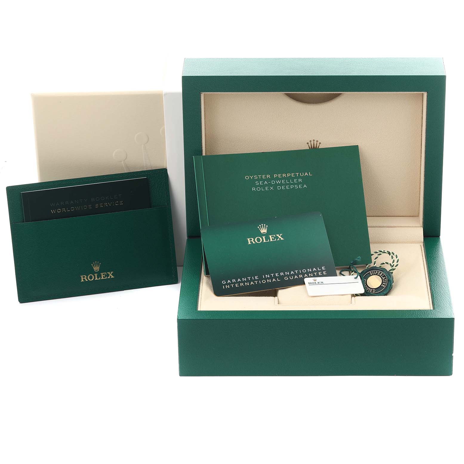 The image shows a Rolex Sea-Dweller 126600 Men's Stainless Steel Black Dial 126600 Men's Stainless Steel Black Dial box with warranty cards, booklets, and tags from a front angle.