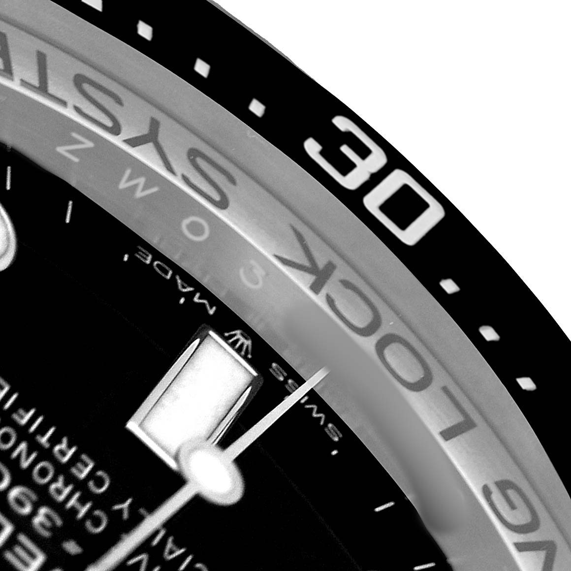 The image shows a close-up of the bezel and part of the dial of the Rolex Sea-Dweller 126660 Men's Stainless Steel Black Dial, focusing on the edges and markings.