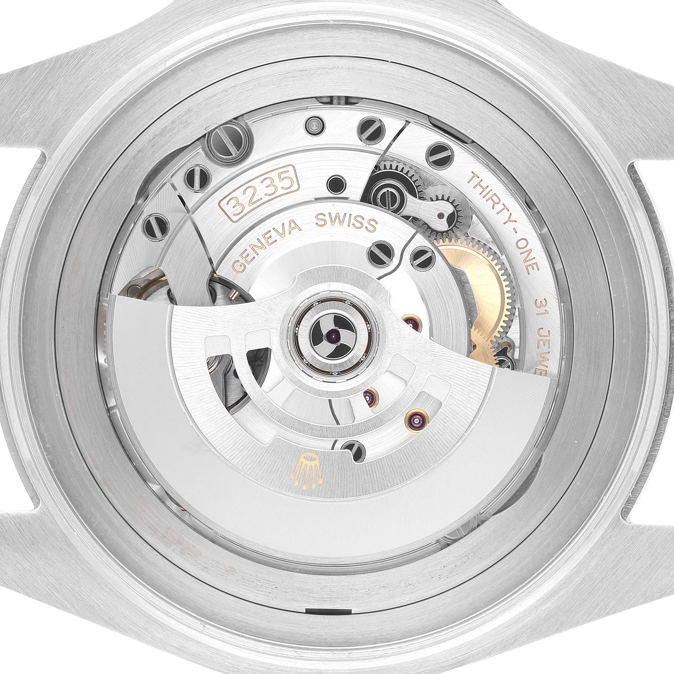 The image shows the movement of a Rolex Sea-Dweller 126660 Men's Stainless Steel Black Dial, viewed from the back, featuring gears and inscriptions.