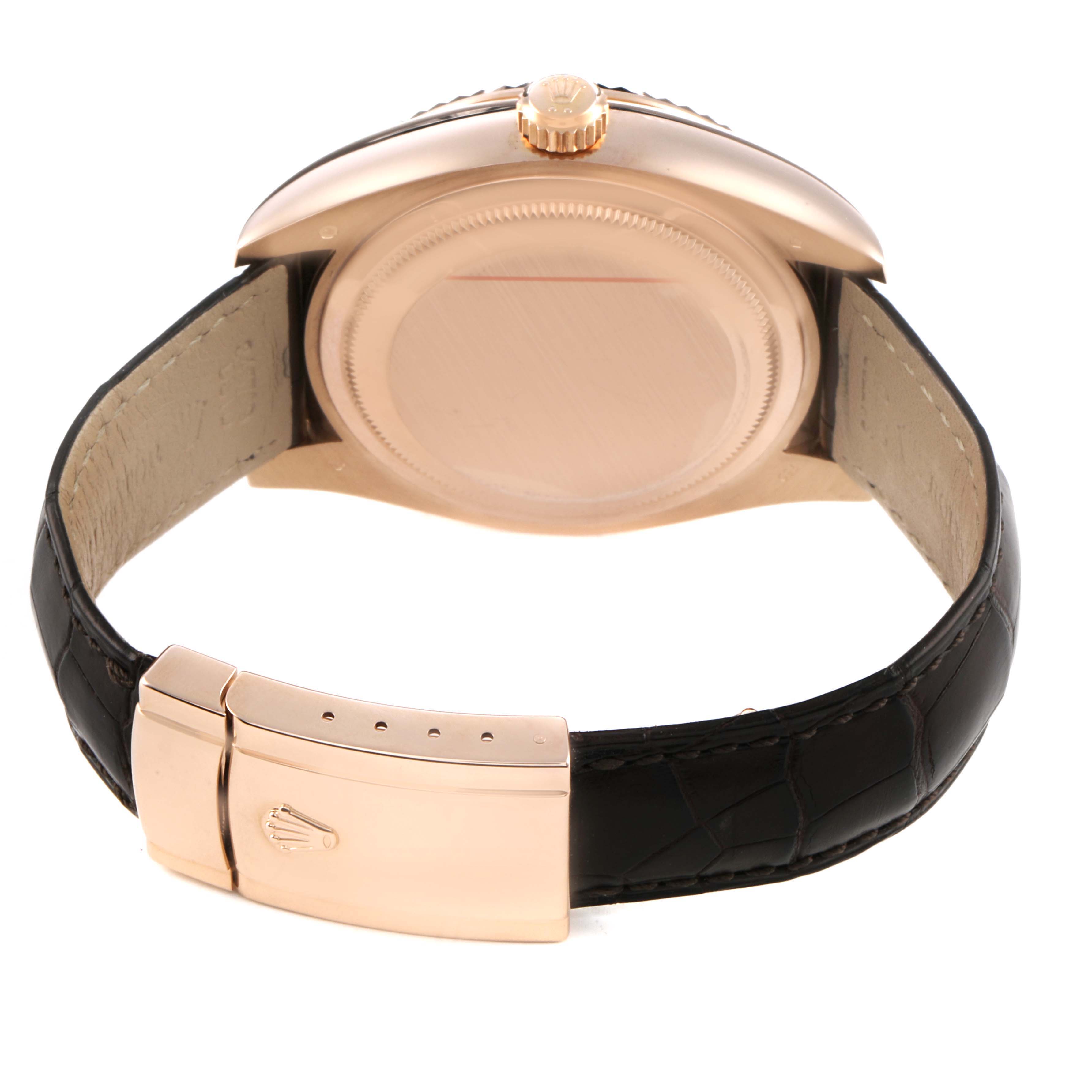 The image shows the back of the Rolex Sky-Dweller 326135 Men's Rose Gold Brown Dial watch, highlighting the case back and the clasp of the leather strap.