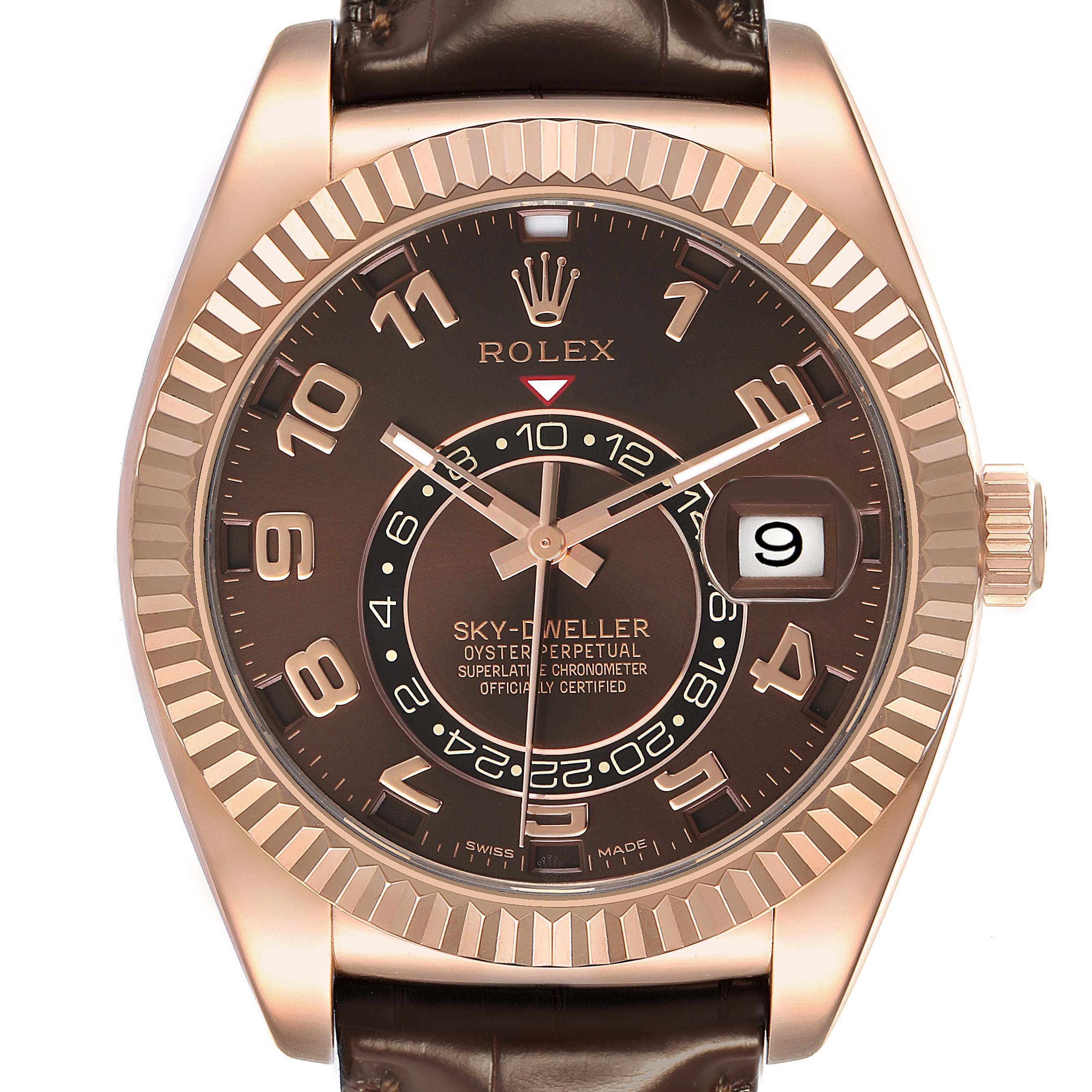 The Rolex Sky-Dweller 326135 Men's Rose Gold Brown Dial watch is shown from a front angle, highlighting the face, bezel, date window, and leather strap.