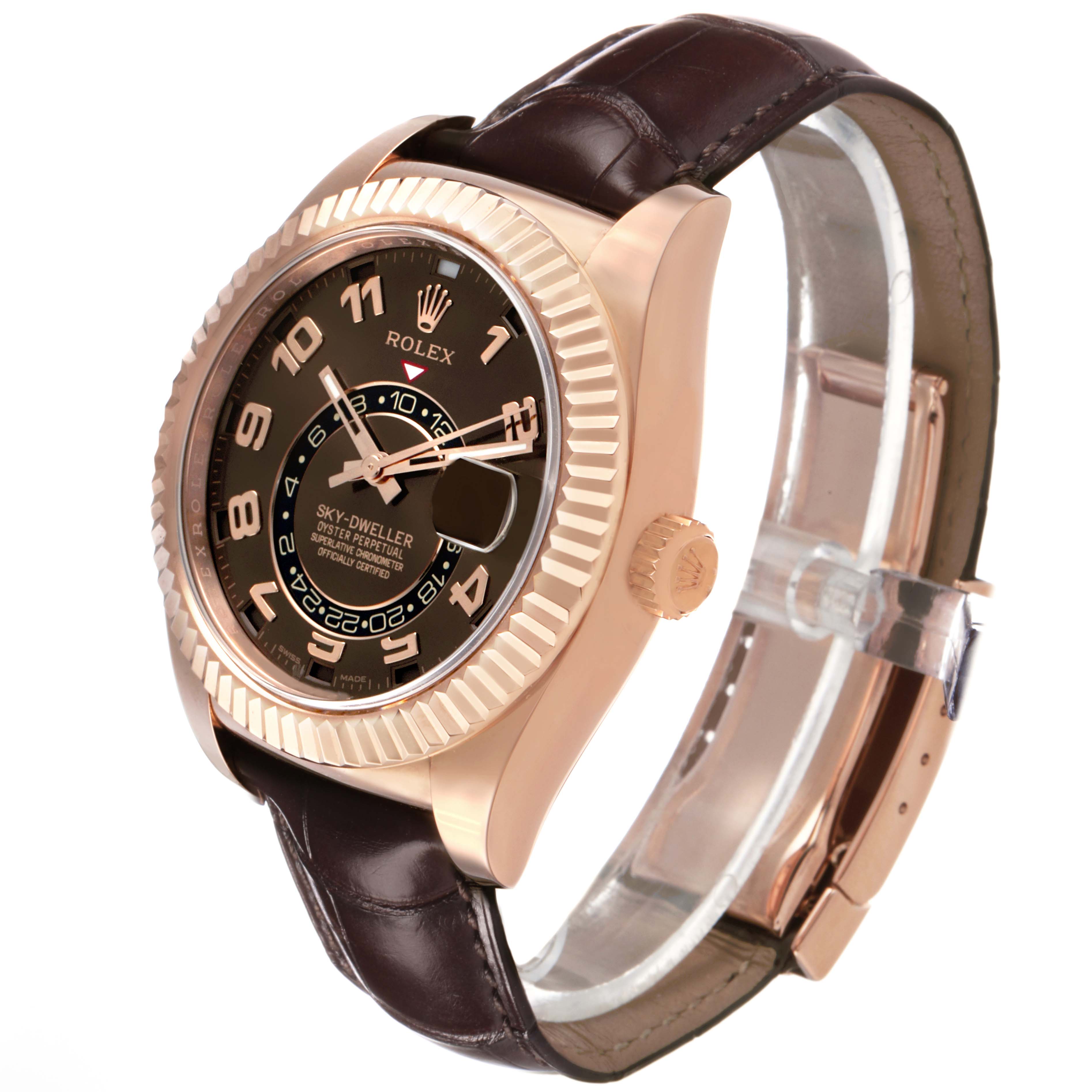 The Rolex Sky-Dweller 326135 Men's Rose Gold Brown Dial watch is shown at an angle highlighting the face, bezel, crown, and leather strap.