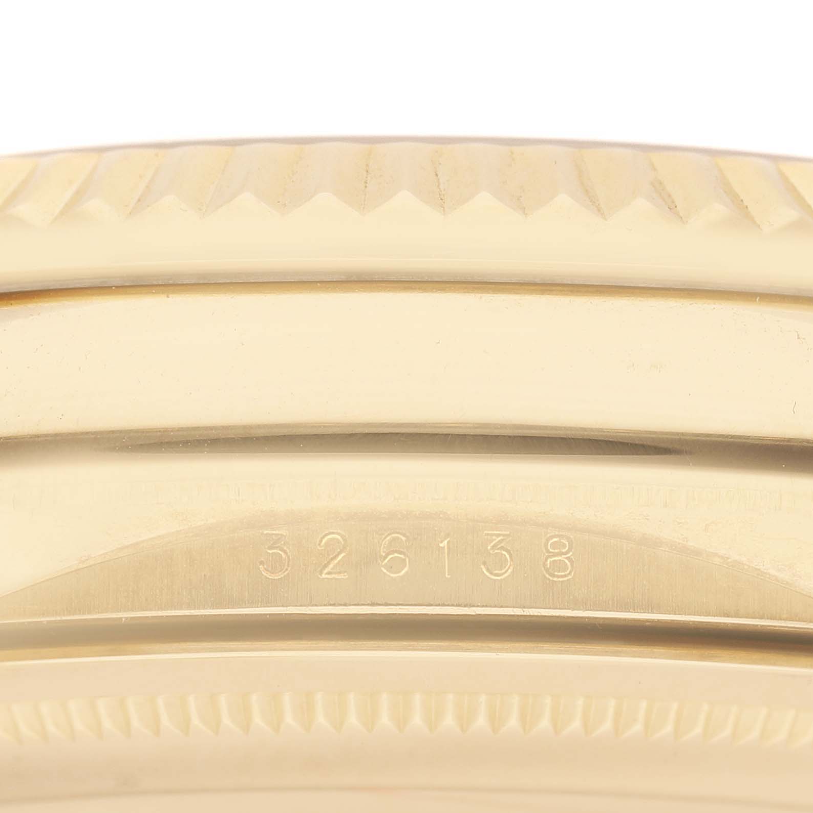 The image shows a close-up of the engraved model number on the side of a Rolex Sky-Dweller 326138 Men's Yellow Gold Silver Dial watch case.
