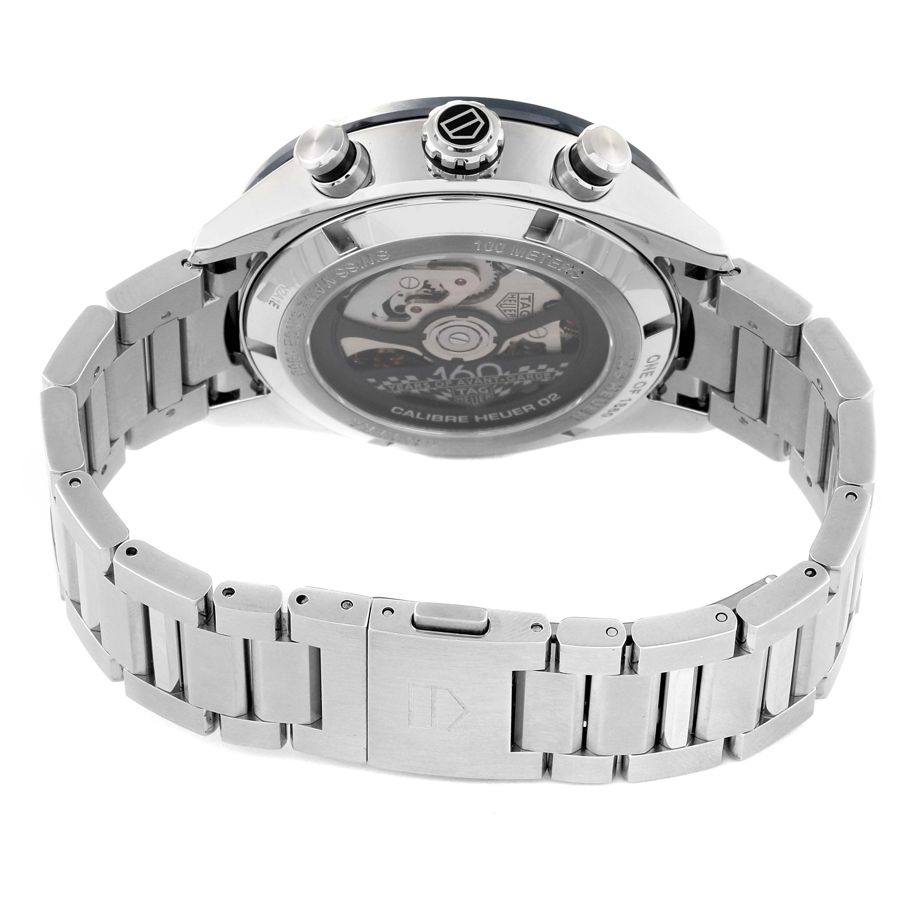 The image shows the back view of the Tag Heuer Carrera CBN2A1E Men's Stainless Steel Blue Dial CBN2A1E Men's Stainless Steel Blue Dial watch, highlighting the clasp, bracelet, and transparent case back.