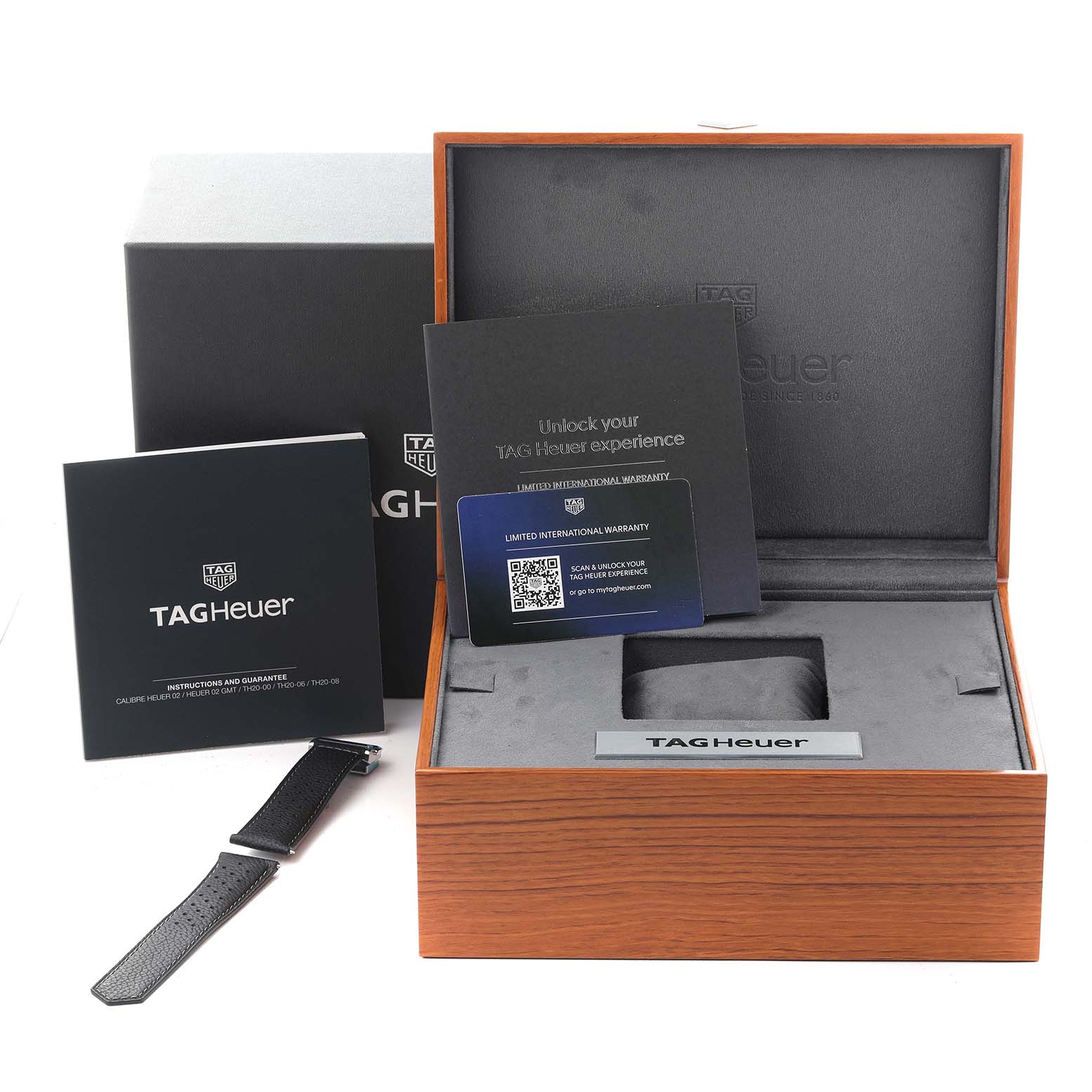 The image shows the box, warranty card, manual, and strap of the Tag Heuer Carrera CBN201M.EA0016 Men's Stainless Steel White Dial CBN201M.EA0016 Men's Stainless Steel White Dial watch from a front angle.