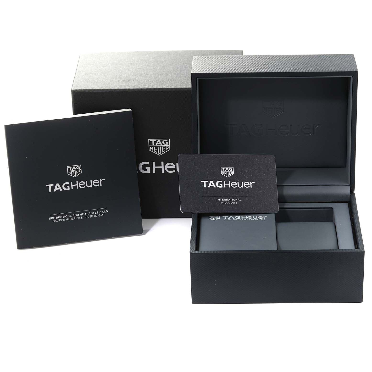 The image shows the packaging, instruction manuals, and warranty card for the Tag Heuer Monaco CBL2111.FC6453 Men's Stainless Steel Blue Dial CBL2111.FC6453 Men's Stainless Steel Blue Dial watch model.