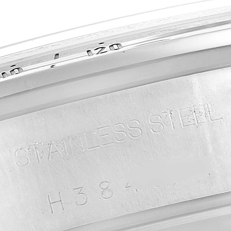 The image shows the side of the case of a Tudor Tiger 79280 Men's Stainless Steel Silver Dial 79280 Men's Stainless Steel Silver Dial watch displaying the "Stainless Steel" engraving.