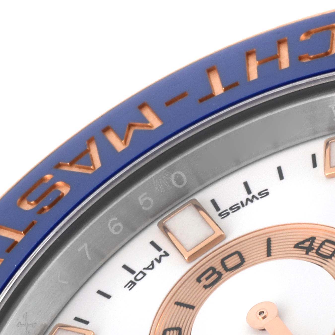 The image shows a close-up of the bezel and partial dial of a Rolex Yacht-Master 116681 Men
s Steel and Gold (two tone) White Dial 116681 Men
s Steel and Gold (two tone) White Dial watch.