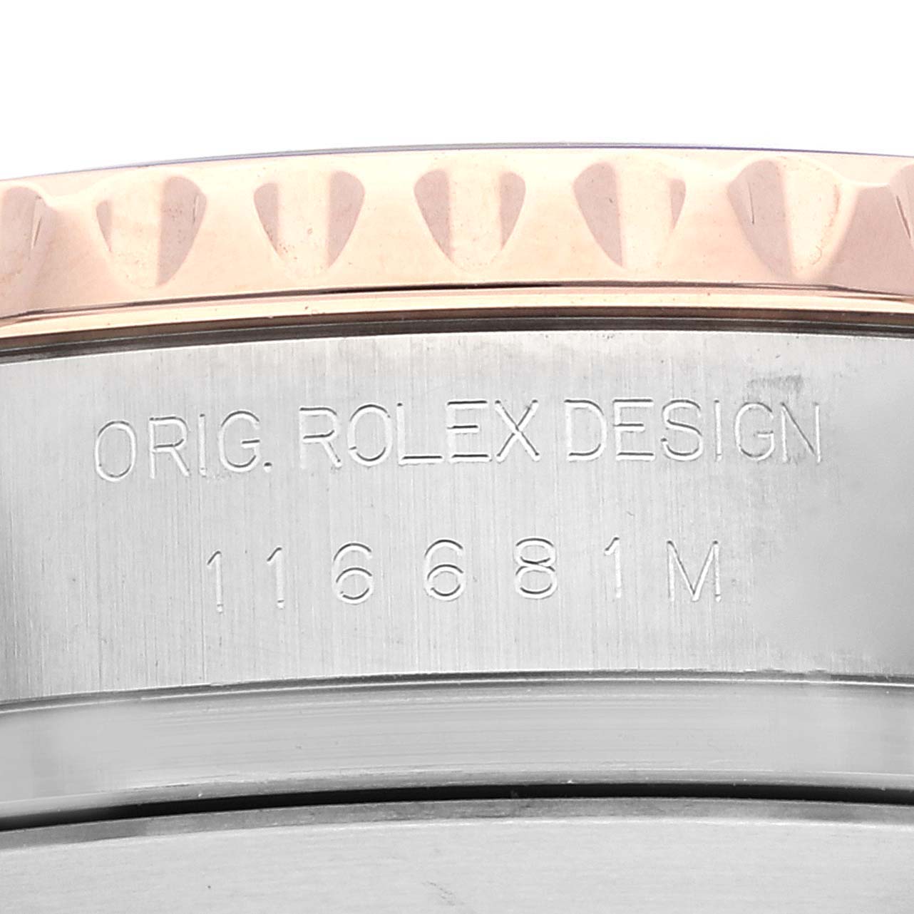 The image shows a close-up of the Rolex Yacht-Master 116681 Men
s Steel and Gold (two tone) White Dial 116681 Men
s Steel and Gold (two tone) White Dial model
s case back, displaying the design engraving and model number.