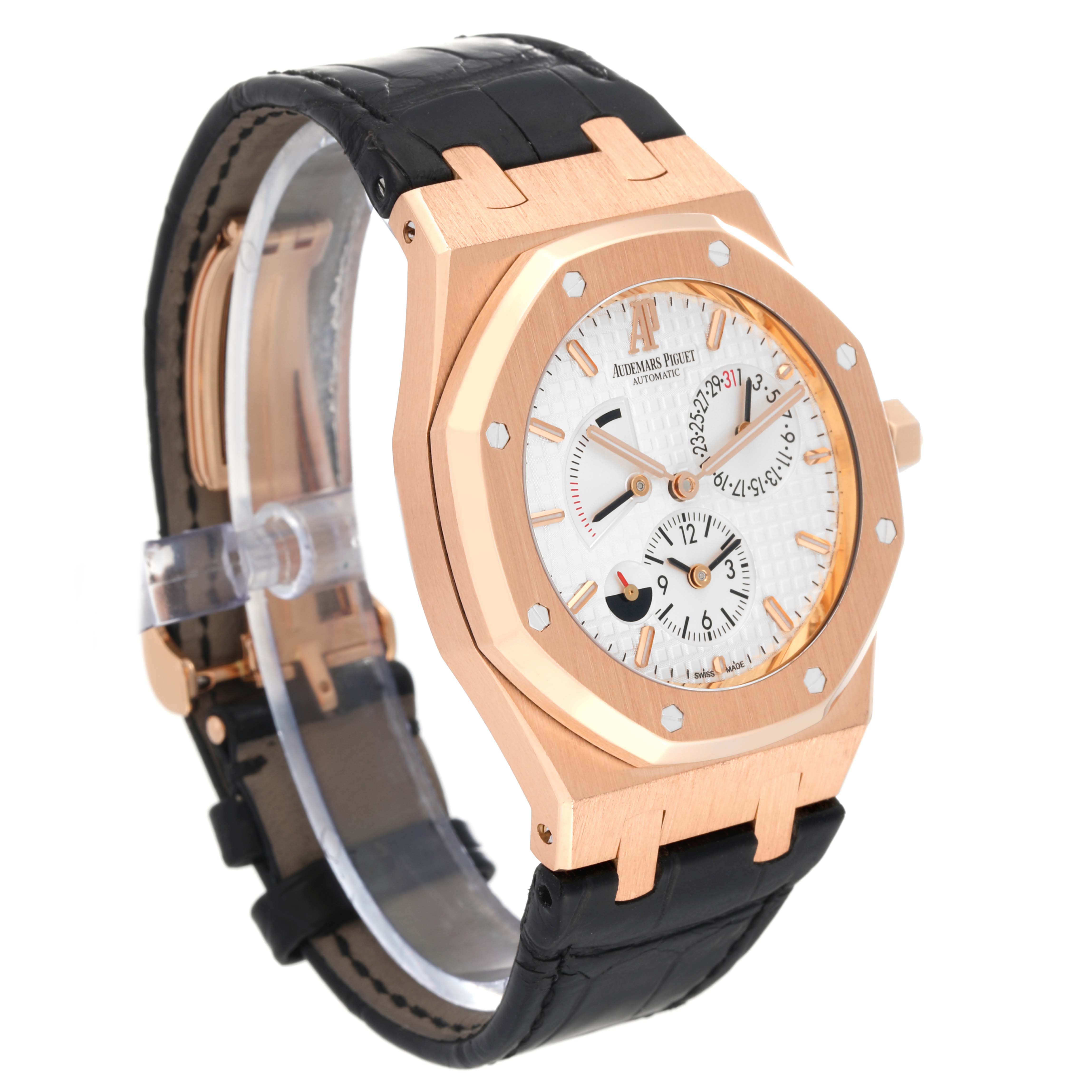 The image shows a side angle of an Audemars Piguet Royal Oak 26120OR.OO.D088CR.01 Men's Rose Gold Silver Dial 26120OR.OO.D088CR.01 Men's Rose Gold Silver Dial watch, highlighting its case, bezel, dial, and strap.