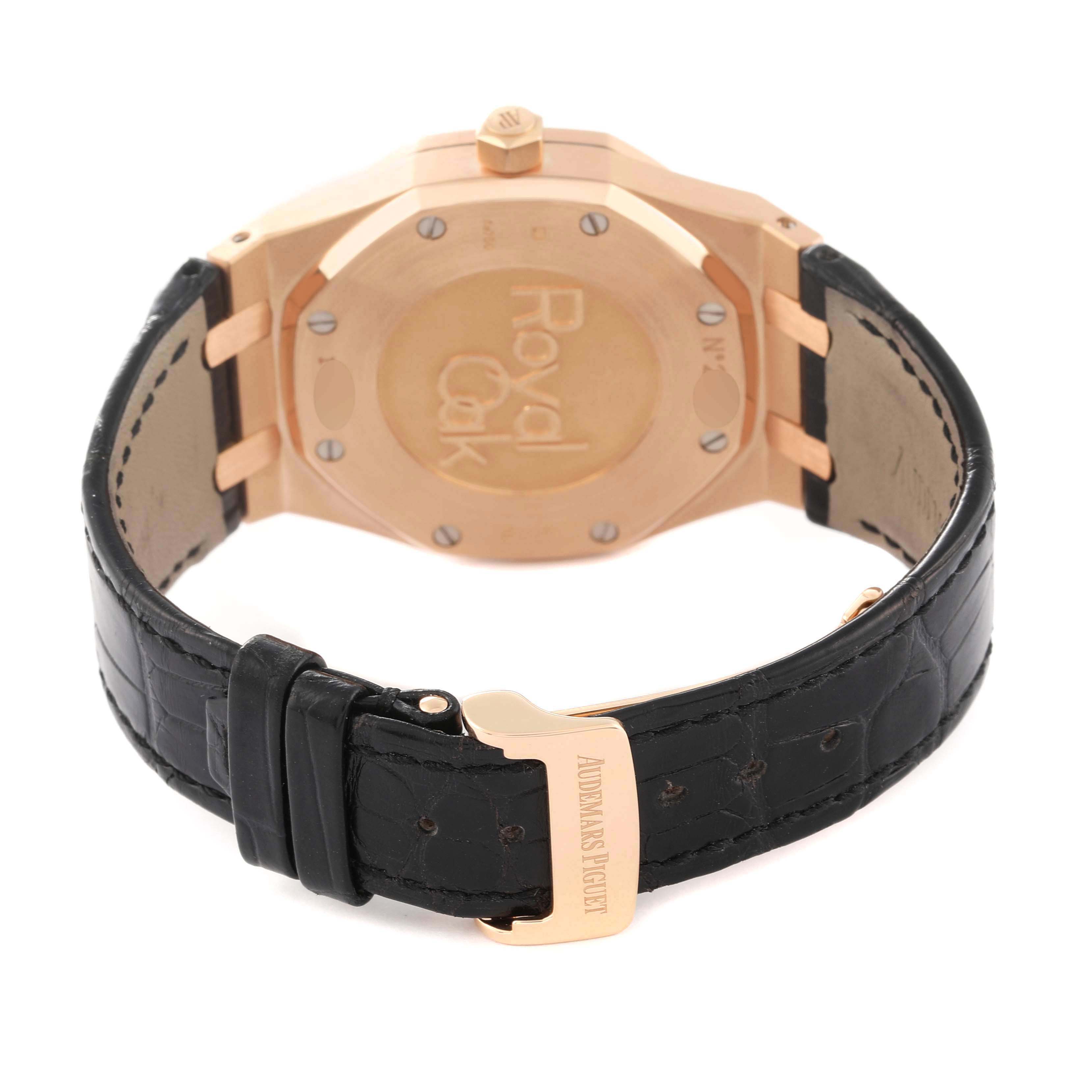 The image shows the back view of an Audemars Piguet Royal Oak 26120OR.OO.D088CR.01 Men's Rose Gold Silver Dial 26120OR.OO.D088CR.01 Men's Rose Gold Silver Dial watch, displaying its case back and leather strap.