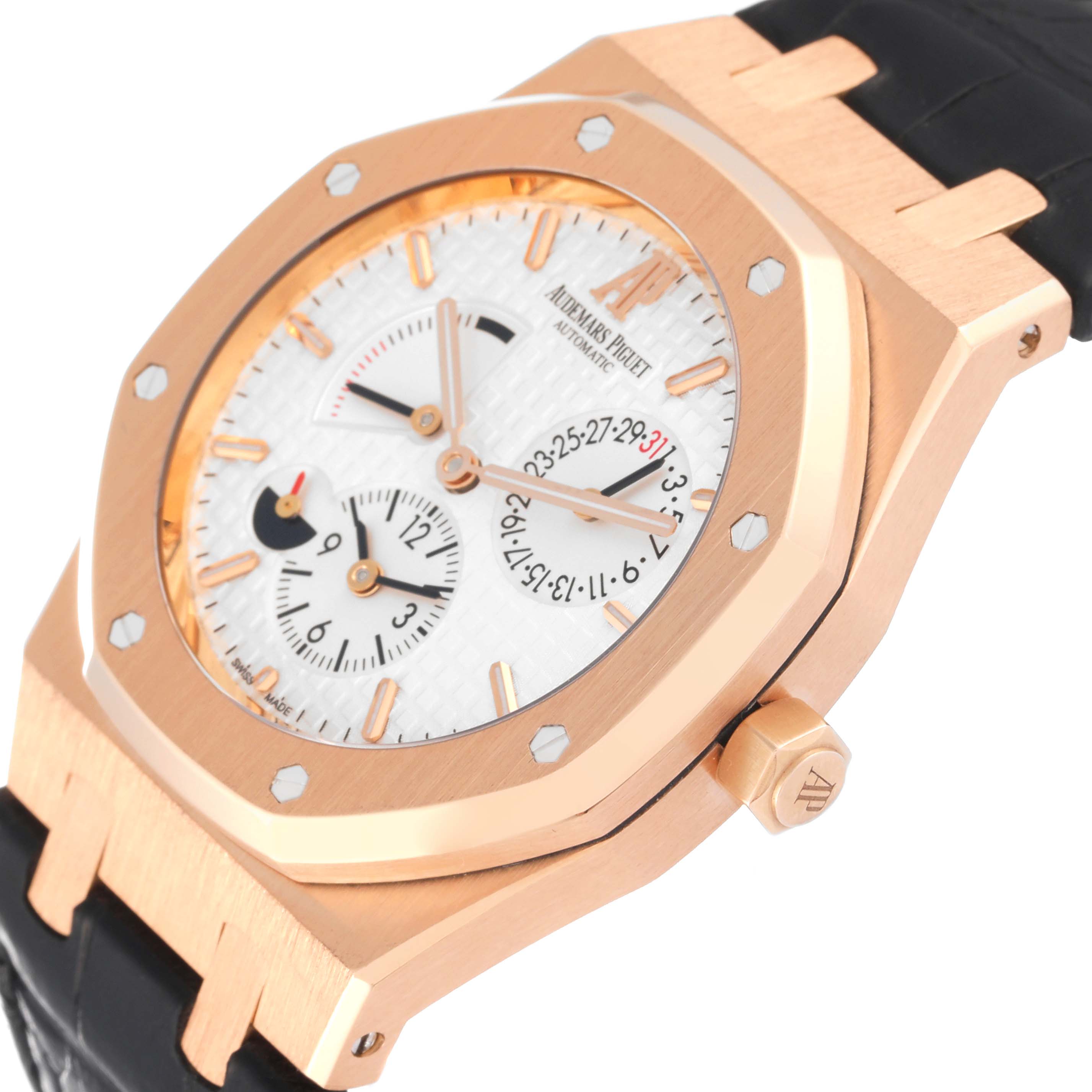 The image shows a side angle of the Audemars Piguet Royal Oak 26120OR.OO.D088CR.01 Men's Rose Gold Silver Dial 26120OR.OO.D088CR.01 Men's Rose Gold Silver Dial watch, highlighting the case, dial, crown, and part of the leather strap.