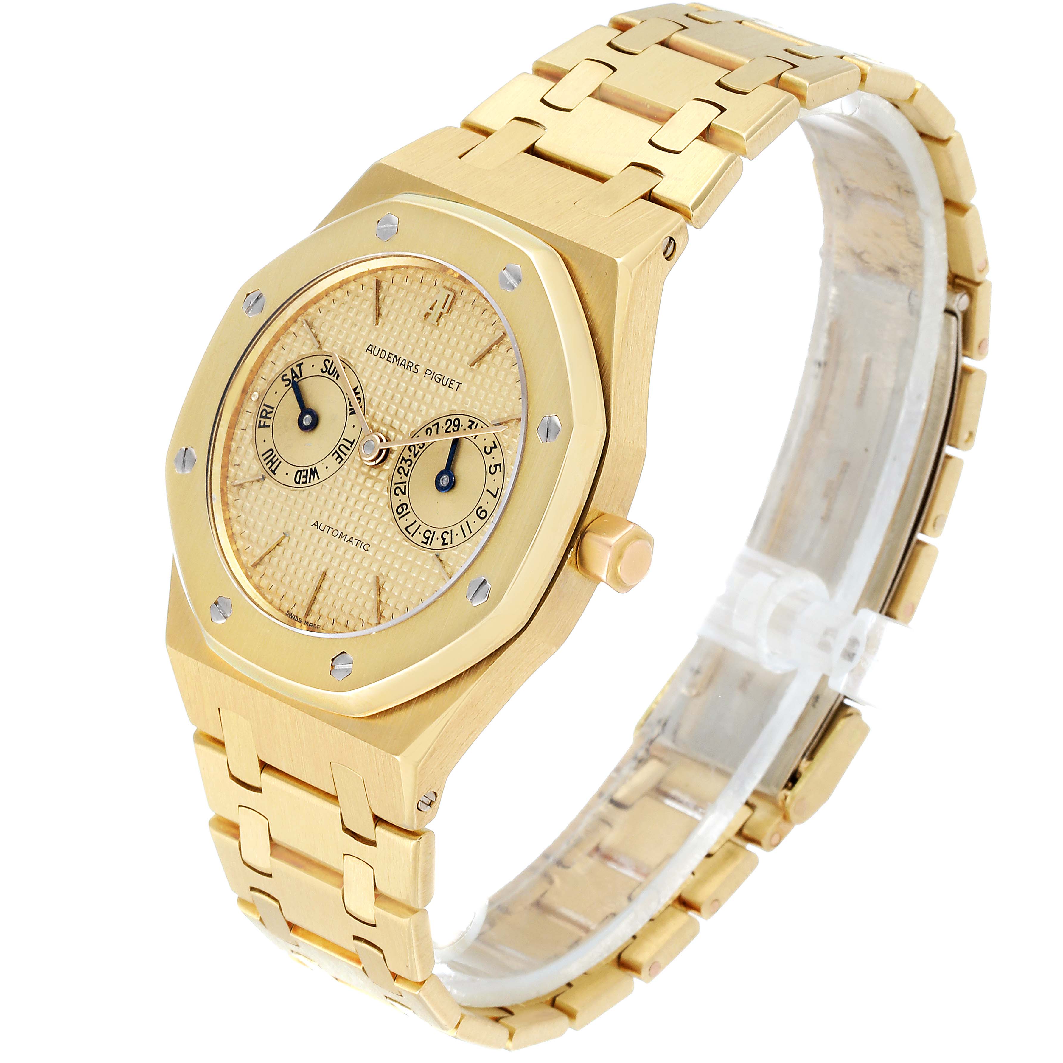 The image shows a three-quarter view of an Audemars Piguet Royal Oak 25572BA.0.0477BA.01 Men's Yellow Gold Champagne Dial 25572BA.0.0477BA.01 Men's Yellow Gold Champagne Dial watch, highlighting the bracelet, dial, bezel, and crown.
