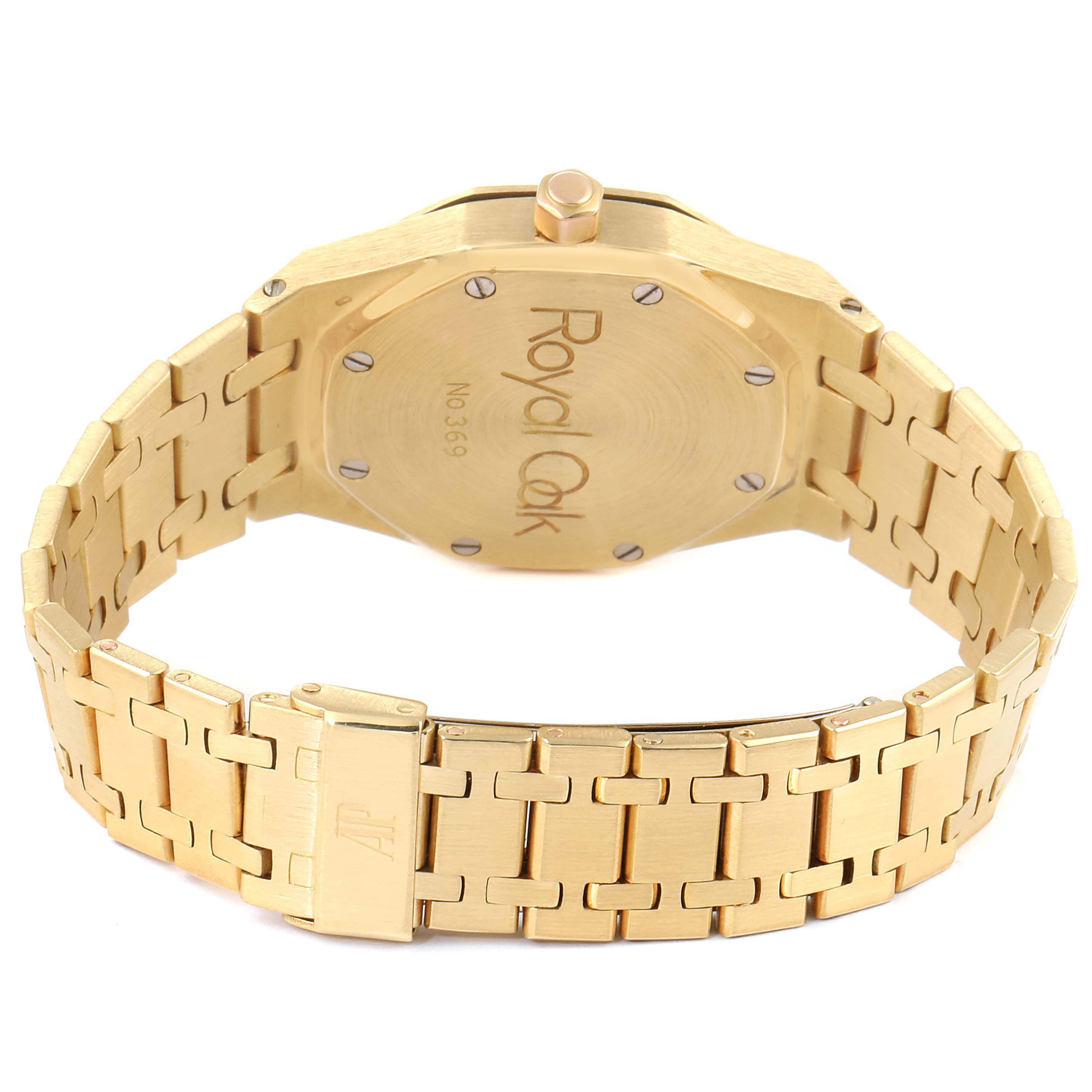 The image shows the back and bracelet of a Royal Oak watch by Audemars Piguet, displaying its engraving and clasp.