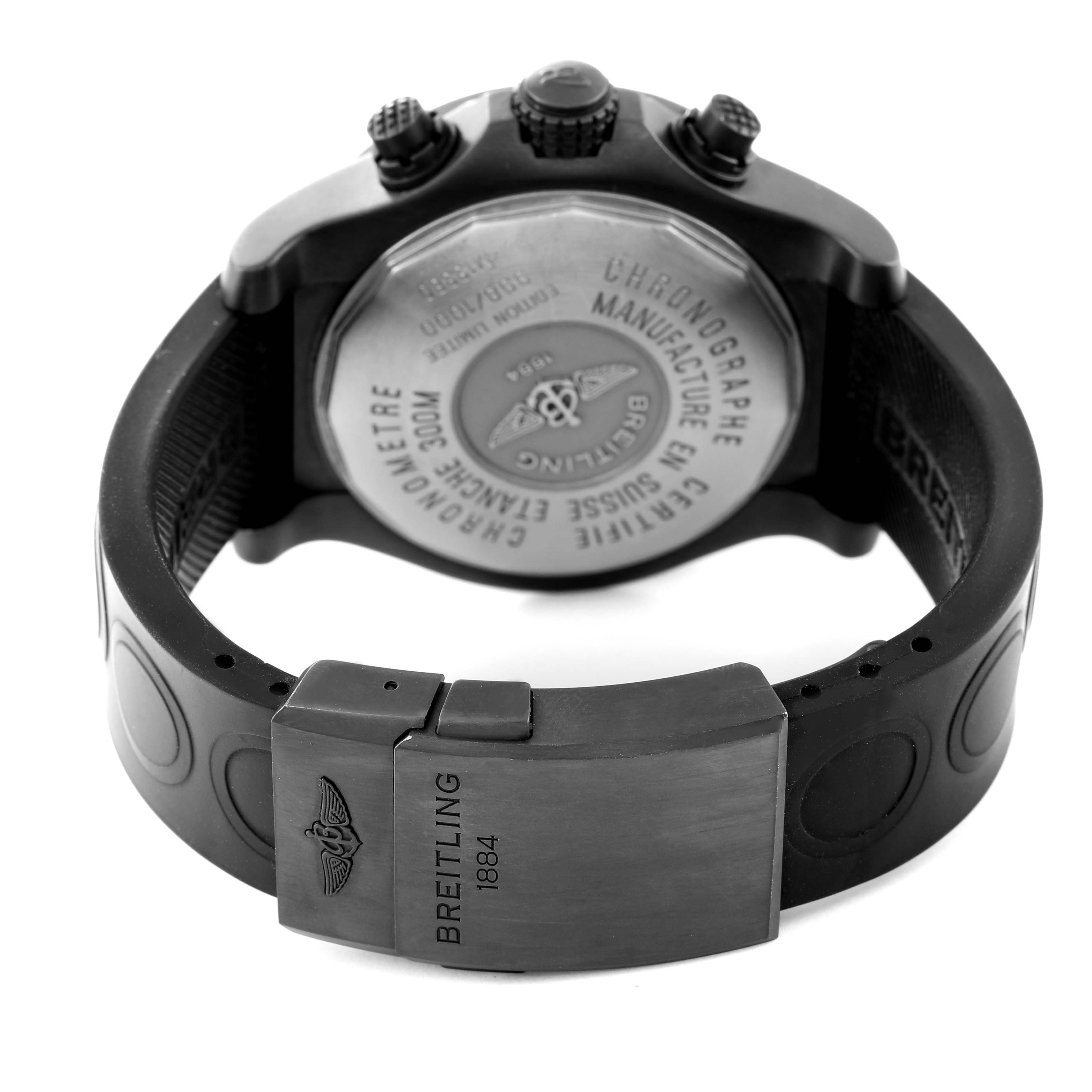 The image shows the back and clasp of a Breitling Avenger M13380 Men's Stainless Steel Black Dial M13380 Men's Stainless Steel Black Dial watch, highlighting the engraved case back and rubber strap closure.