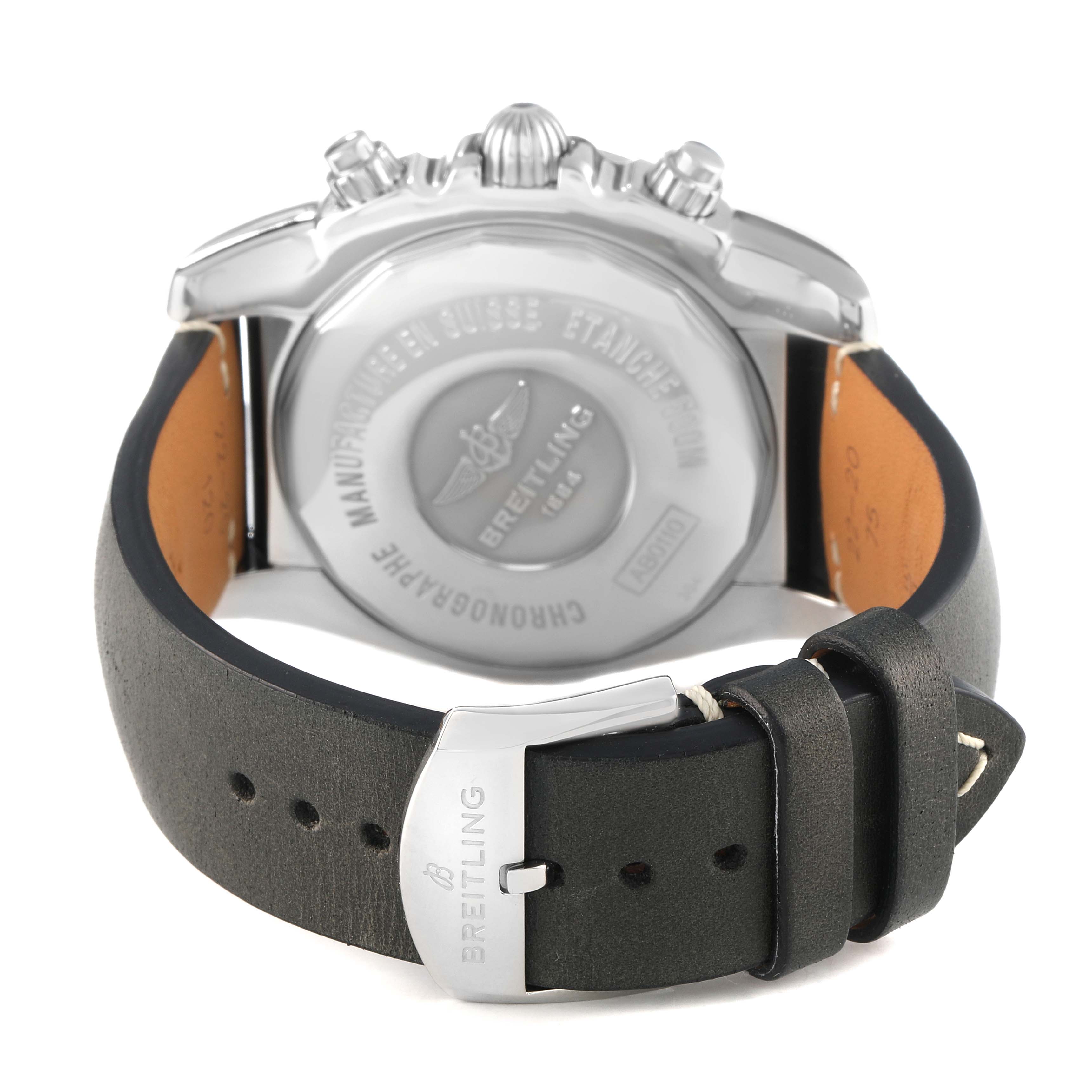 The image shows the back view of a Breitling Chronomat AB0110 Men's Stainless Steel Black Dial, highlighting the case back, crown, pushers, and buckle clasp on the strap.
