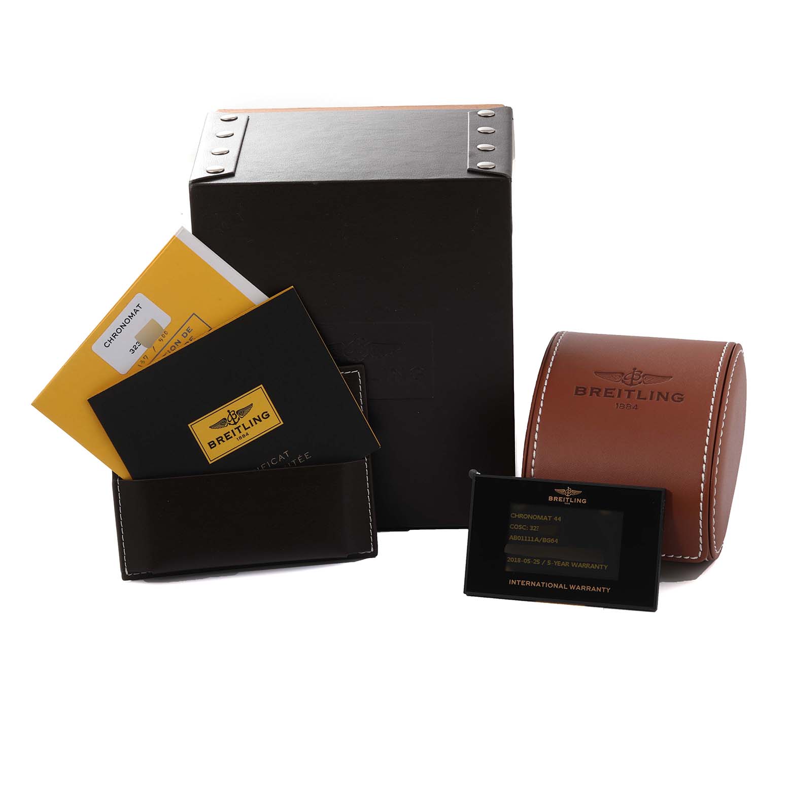 This image shows the packaging, warranty booklet, cards, and leather case for a Breitling Limited Series model watch.