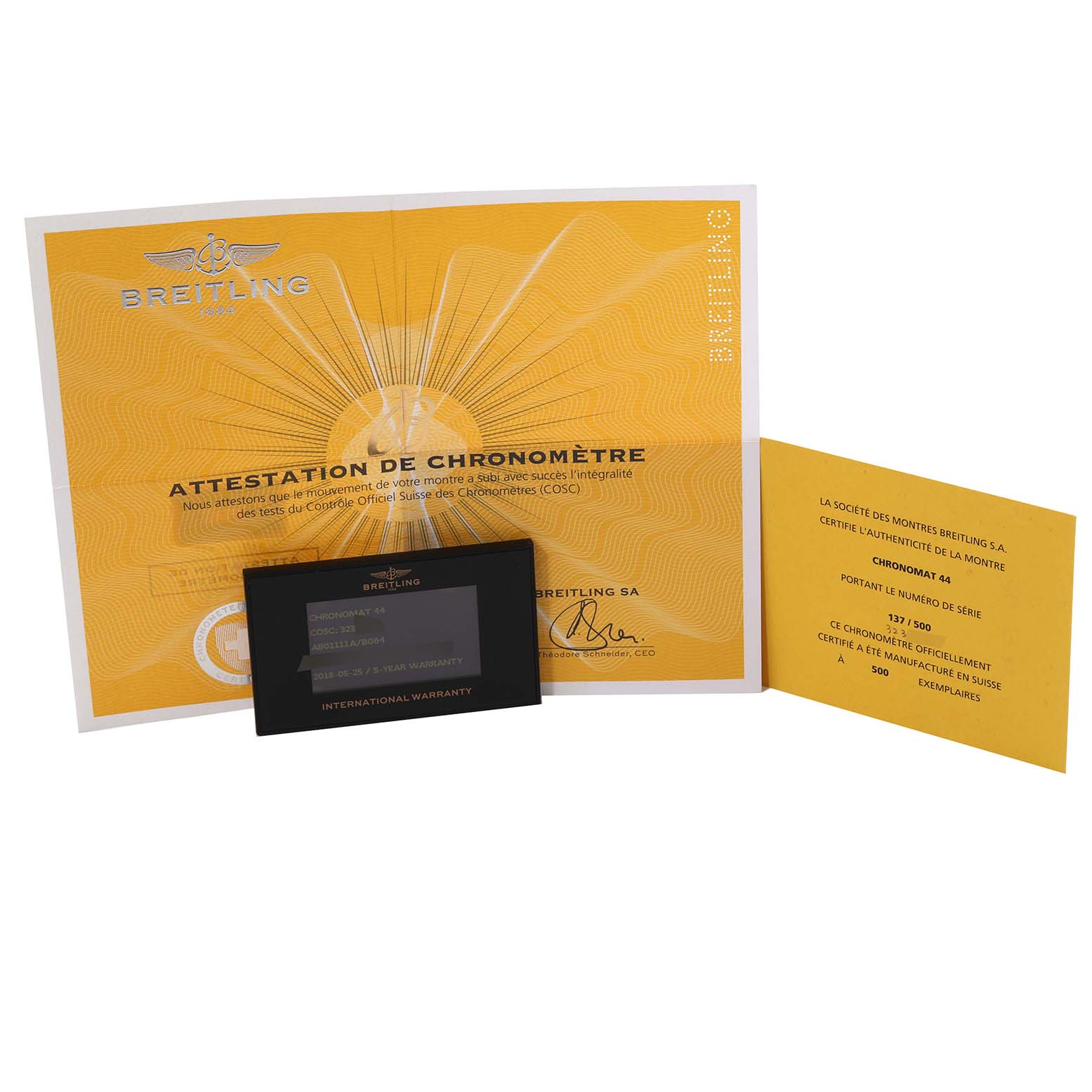 The image shows certificates and an international warranty card for a Breitling Limited Series Chronomat 44 watch.