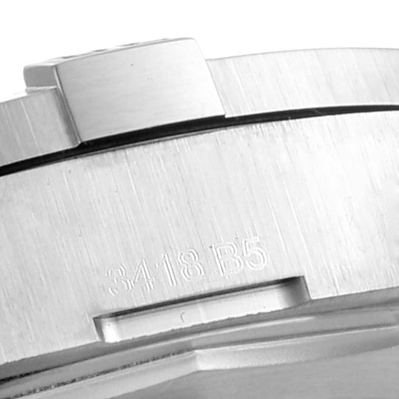 The image shows a close-up of the side of the Breitling Colt A17313 Men
s Stainless Steel Grey Dial A17313 Men
s Stainless Steel Grey Dial watch case, focusing on the bezel and part number engraving.