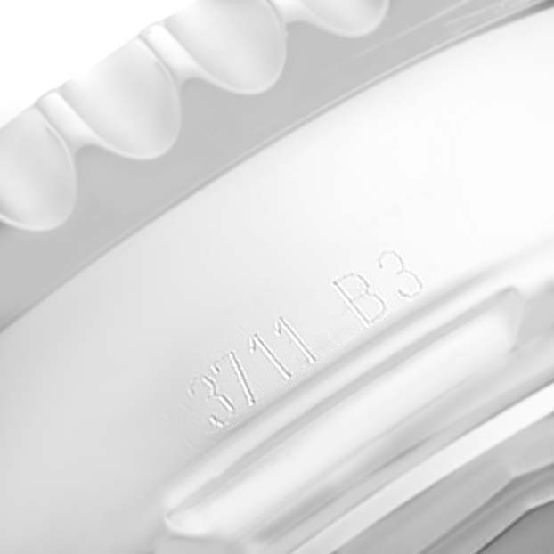 This image shows a close-up angle of the bezel and case side of a Breitling Navitimer AB012721-BD09-453A Men's Stainless Steel Black Dial AB012721-BD09-453A Men's Stainless Steel Black Dial watch, featuring engraved text.