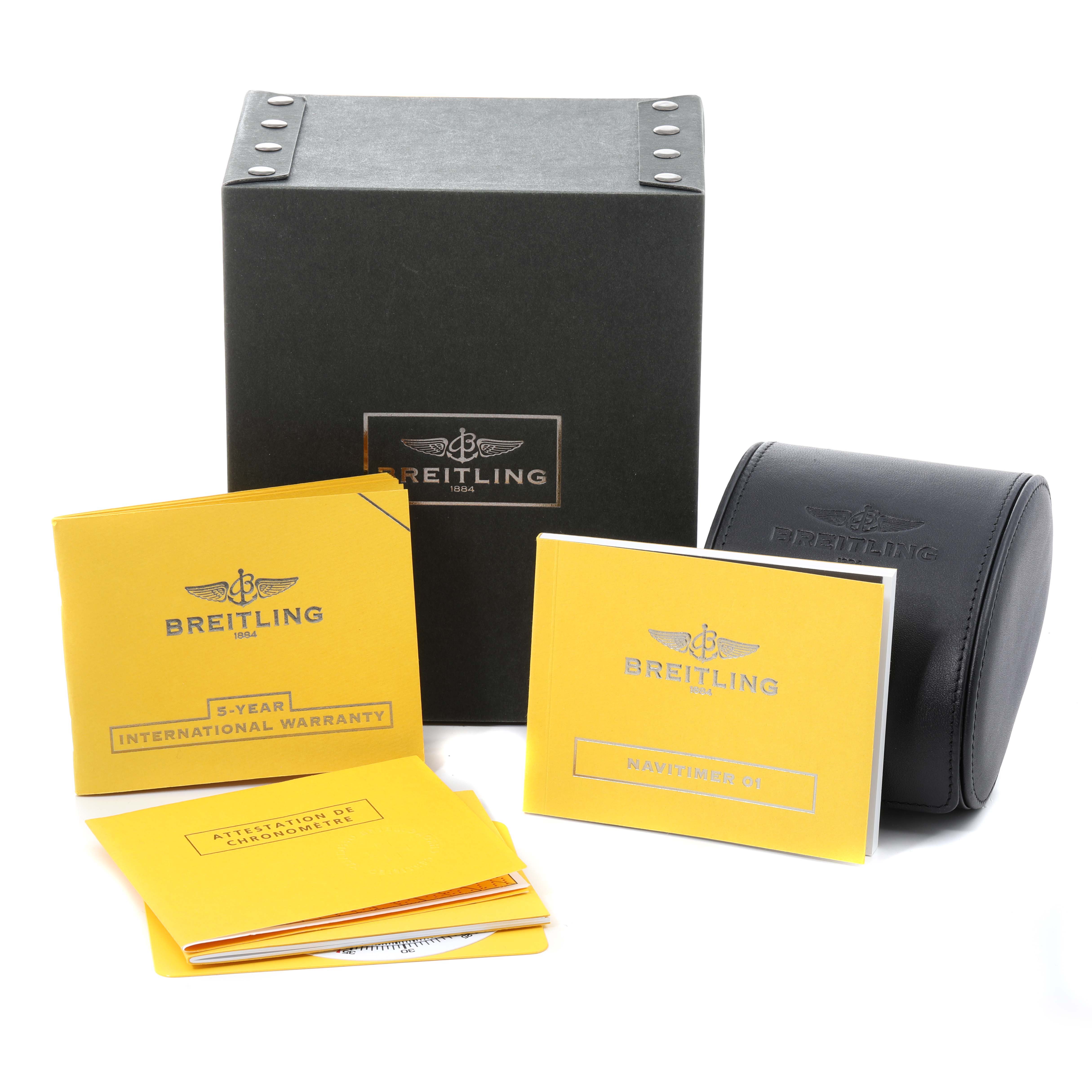 The image shows packaging and booklets, including warranty and manual, for a Breitling Navitimer AB012721-BD09-453A Men's Stainless Steel Black Dial AB012721-BD09-453A Men's Stainless Steel Black Dial watch.