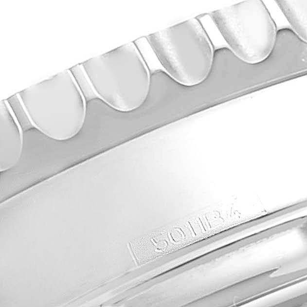 The image shows a close-up of the bezel and part of the case of a Breitling Navitimer AB012721-BD09-453A Men's Stainless Steel Black Dial AB012721-BD09-453A Men's Stainless Steel Black Dial watch, with a partial view of the engraving.