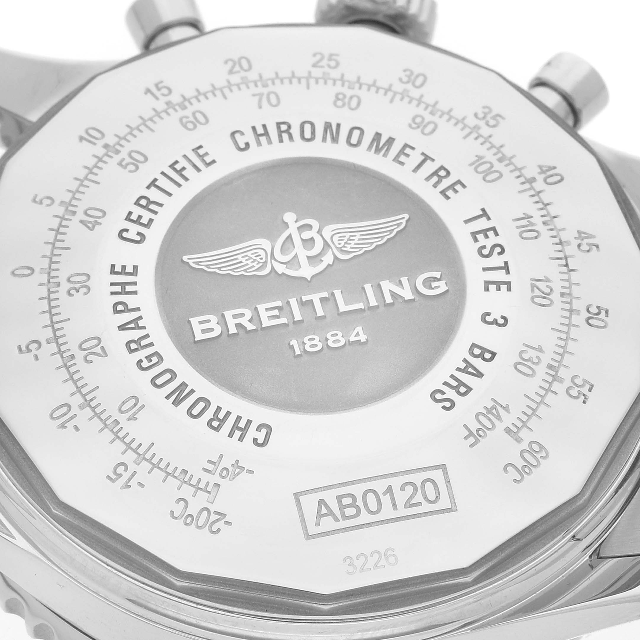 The image shows the close-up of the back casing of a Breitling Navitimer AB012012/G826 Men's Stainless Steel Silver Dial AB012012/G826 Men's Stainless Steel Silver Dial watch, highlighting its branding and certifications.