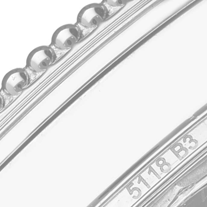 The image shows a close-up of the bezel and serial number of a Breitling Navitimer A17325 Men's Stainless Steel Black Dial A17325 Men's Stainless Steel Black Dial watch.