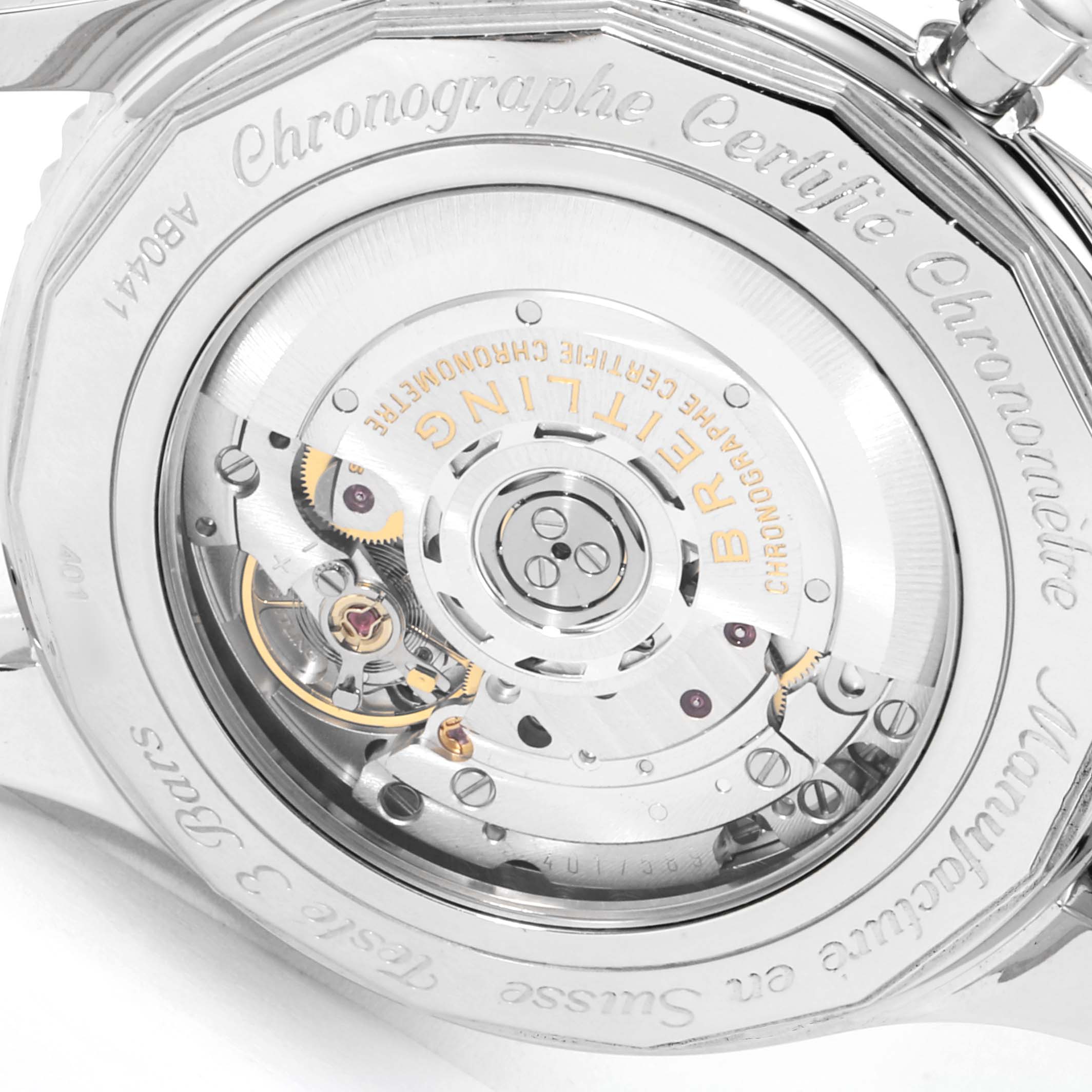 The image shows the back case and movement mechanism of a Breitling Navitimer AB044121-G783-453A Men's Stainless Steel Silver Dial AB044121-G783-453A Men's Stainless Steel Silver Dial watch viewed from a close-up angle.