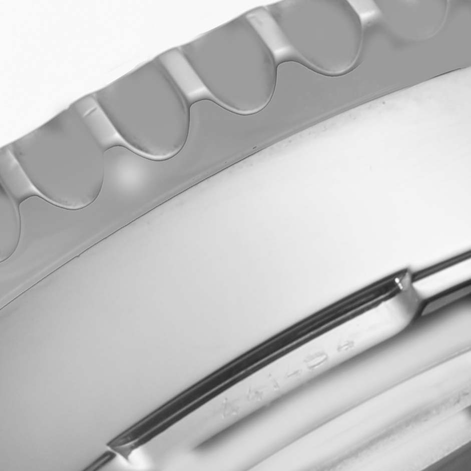 This image shows a close-up of the bezel and case edge of a Breitling Navitimer AB044121-G783-453A Men's Stainless Steel Silver Dial AB044121-G783-453A Men's Stainless Steel Silver Dial watch.