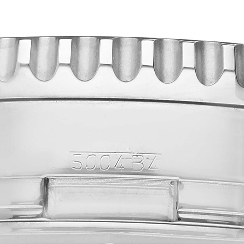 The image shows a close-up of the bezel and part of the case of a Breitling Navitimer A24322 Men
s Stainless Steel Blue Dial A24322 Men
s Stainless Steel Blue Dial watch.