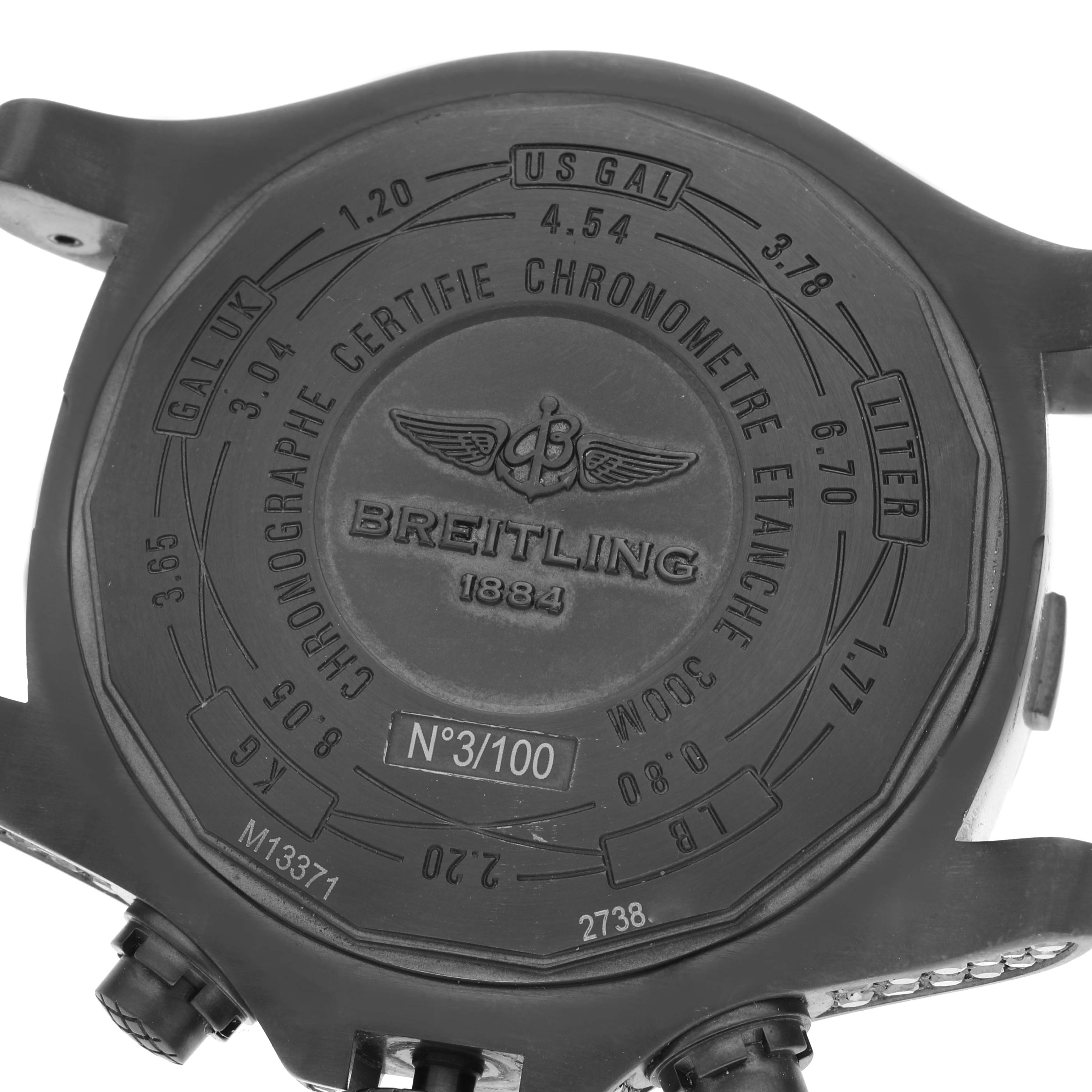 The image shows the back case of the Breitling Avenger M13371BU/BE52 Men's Stainless Steel Mother of Pearl Dial M13371BU/BE52 Men's Stainless Steel Mother of Pearl Dial watch, displaying engravings and serial numbers.
