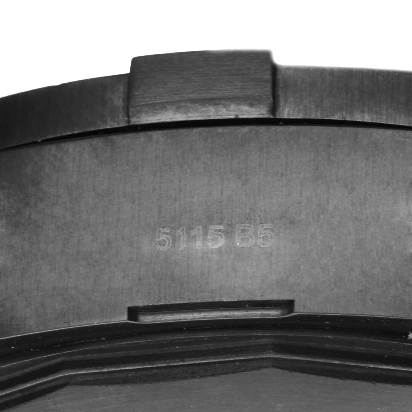 This image shows a close-up of the case back of a Breitling Avenger M13371BU/BE52 Men's Stainless Steel Mother of Pearl Dial M13371BU/BE52 Men's Stainless Steel Mother of Pearl Dial watch, with the engraving "5115 B5."