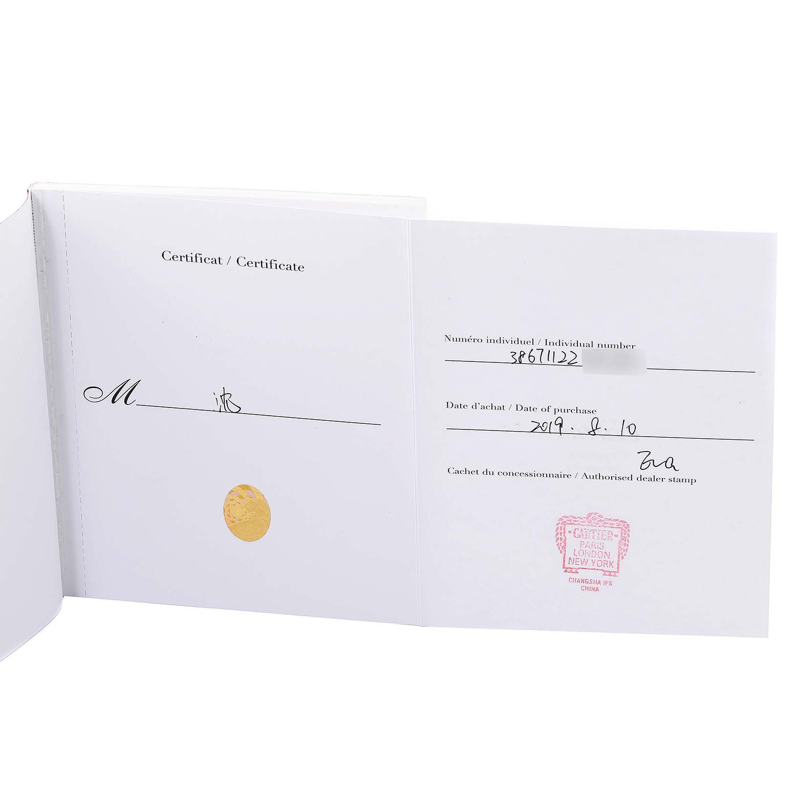 The image shows the certificate and warranty card for the Cle model watch by Cartier, displayed open and flat.