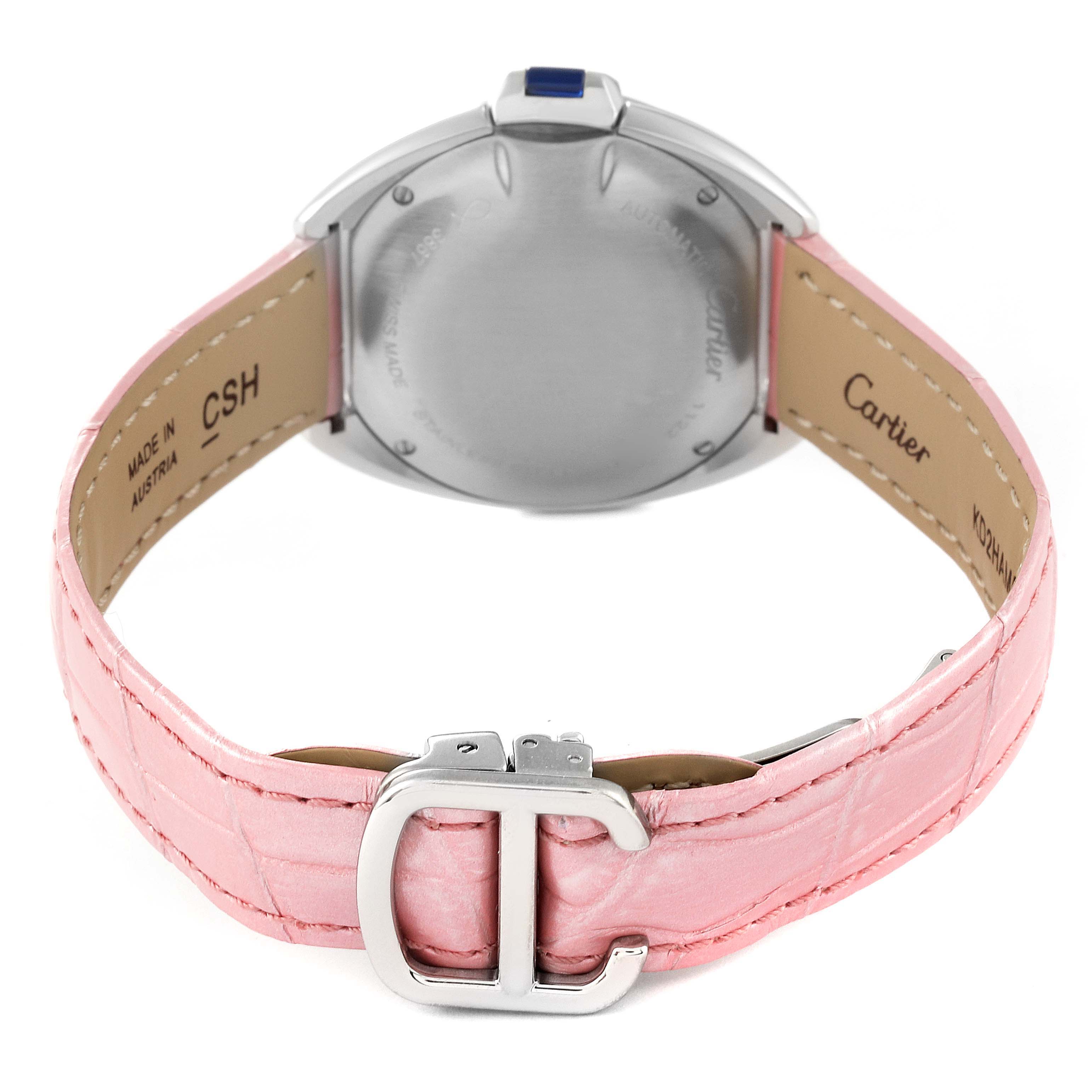 The image shows the back view of a Cartier Clé model watch with its case back, pink leather strap, and buckle visible.