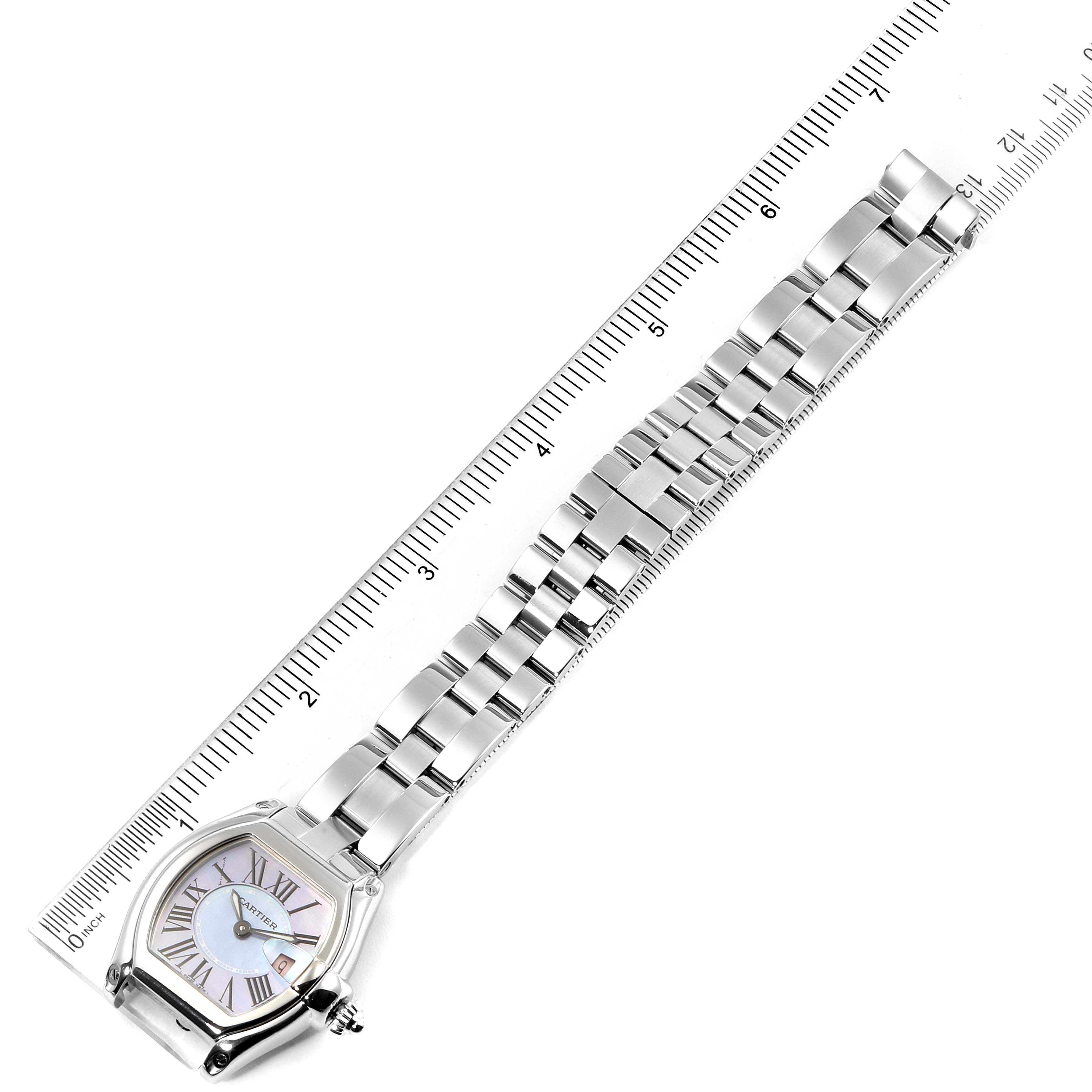 The image shows the Cartier Roadster W6206007 Women's Stainless Steel Mother of Pearl Dial W6206007 Women's Stainless Steel Mother of Pearl Dial watch laid flat with its metal bracelet aligned along a ruler.